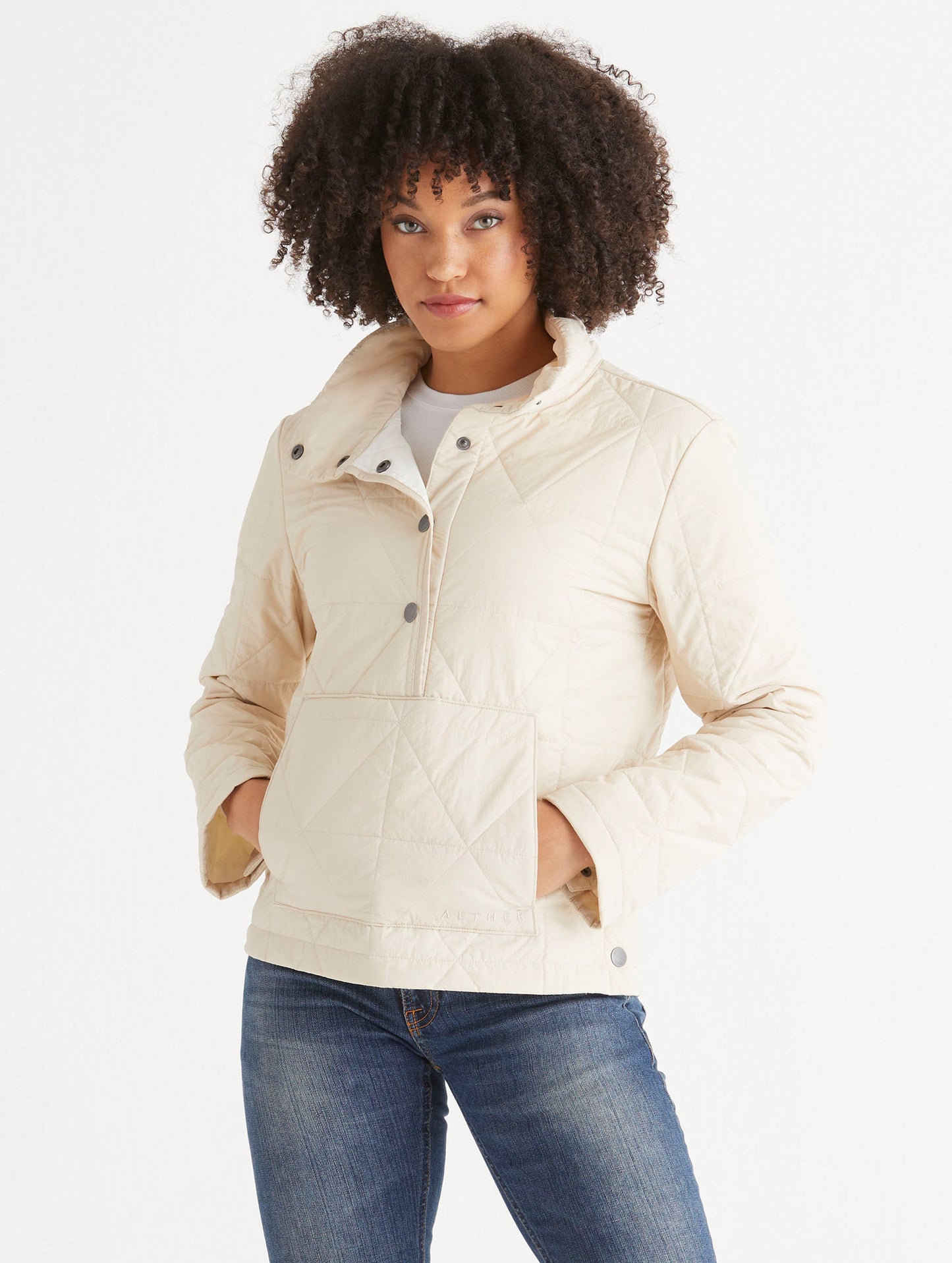 woman wearing light beige pullover