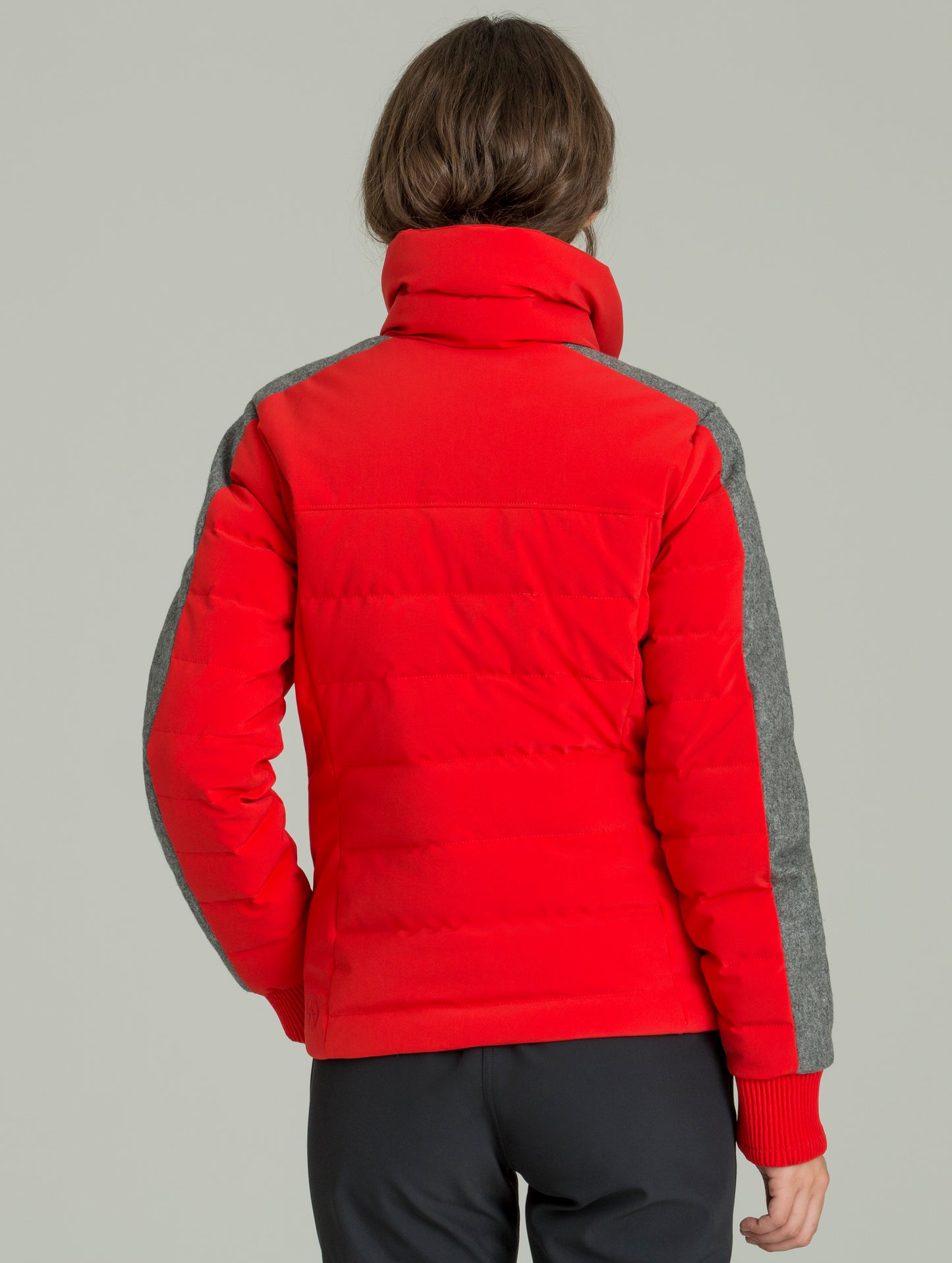 Back view of woman wearing W Nordic Jacket in studio