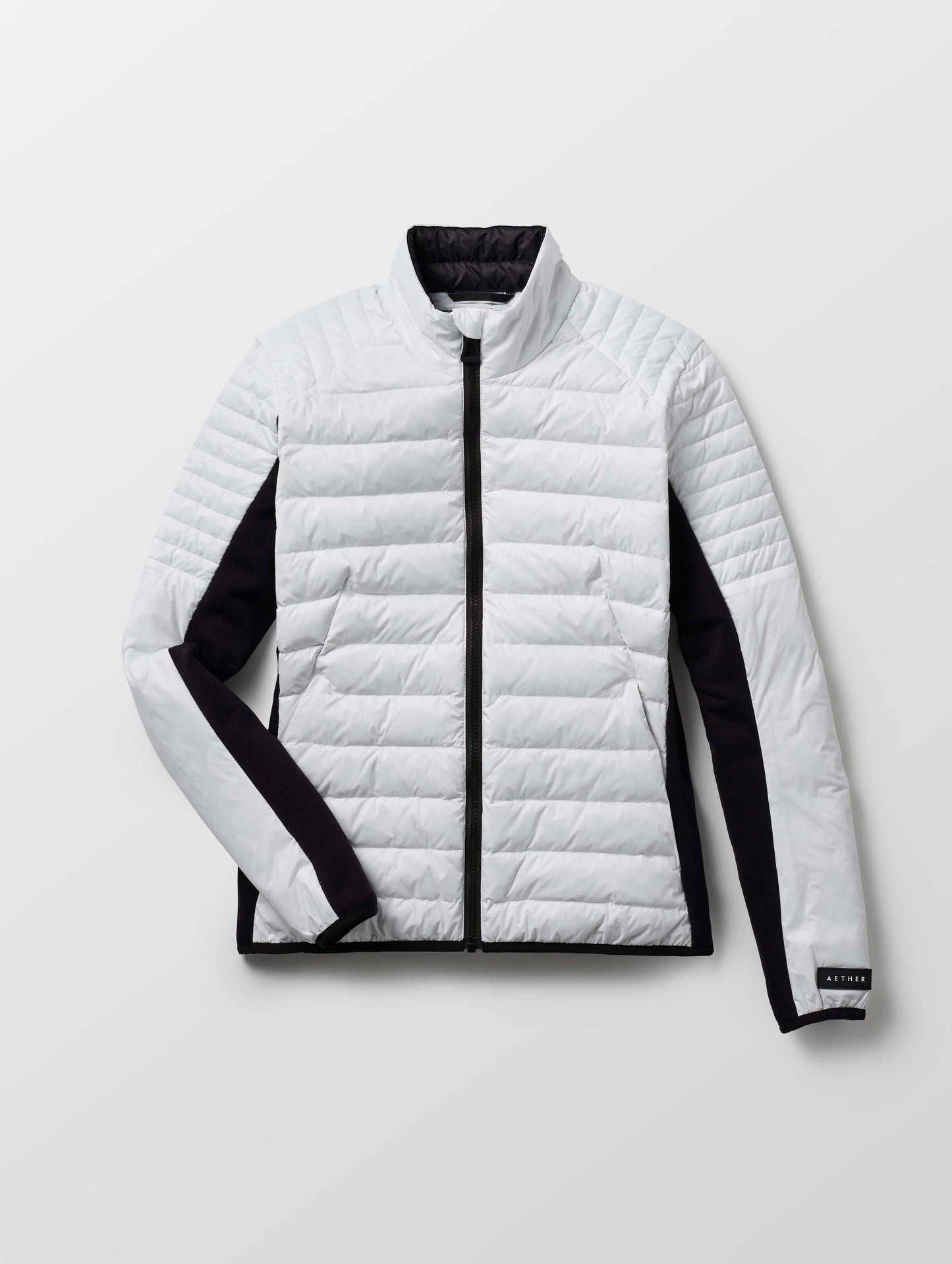 Flat lay of women's Ozone Jacket in White from AETHER Apparel.