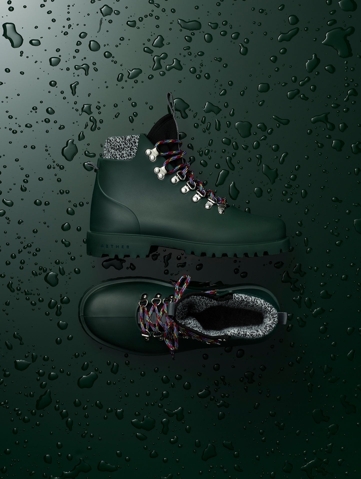 Flat lay view of women's Rain Boot in Dark Green from AETHER Apparel.