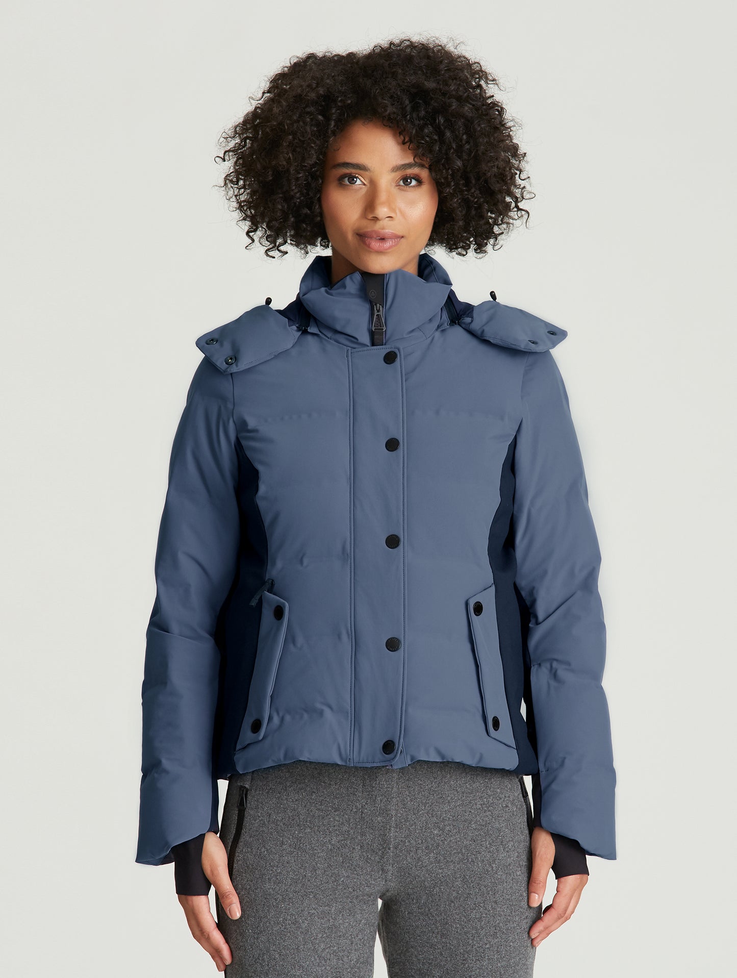Front view of woman wearing Torino Jacket in Baltic Blue from AETHER Apparel.