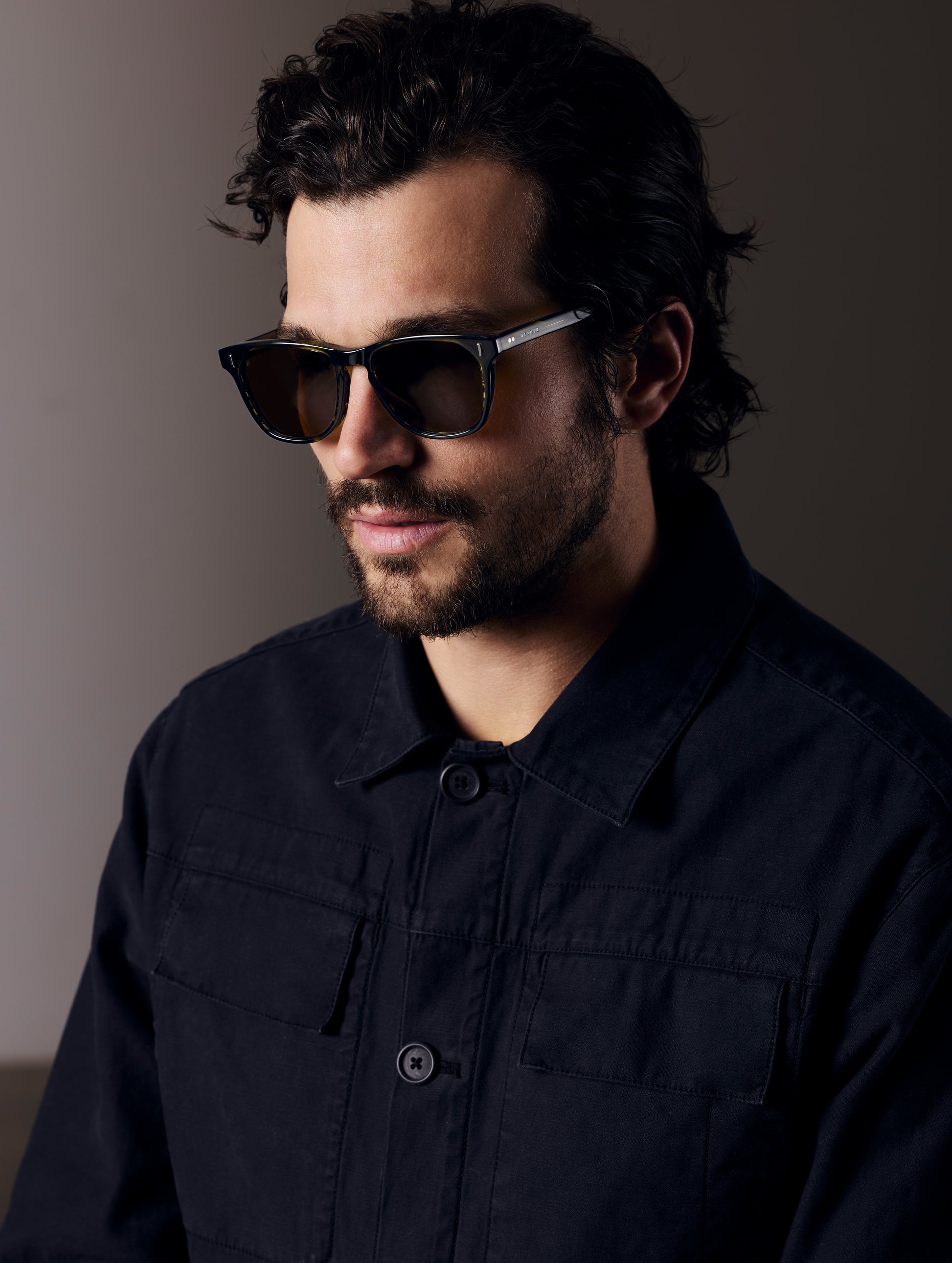 Man wearing green tortoise sunglasses from AETHER Apparel