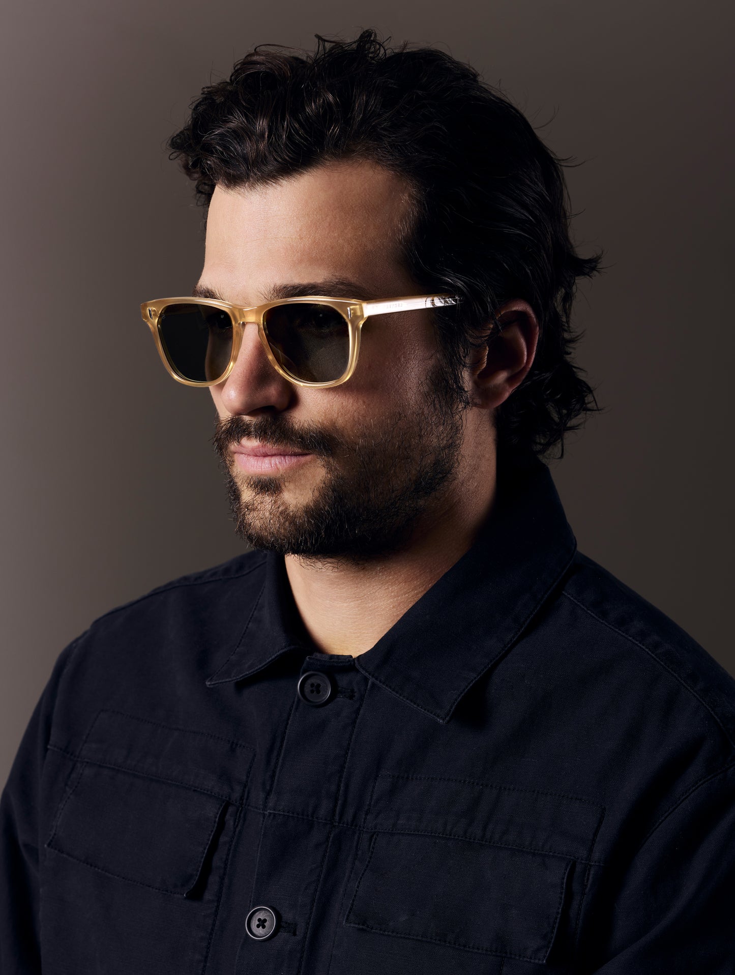 Front left 3/4 view of man wearing Yosemite Sunglass in Honey with G15 Lens from AETHER Apparel.