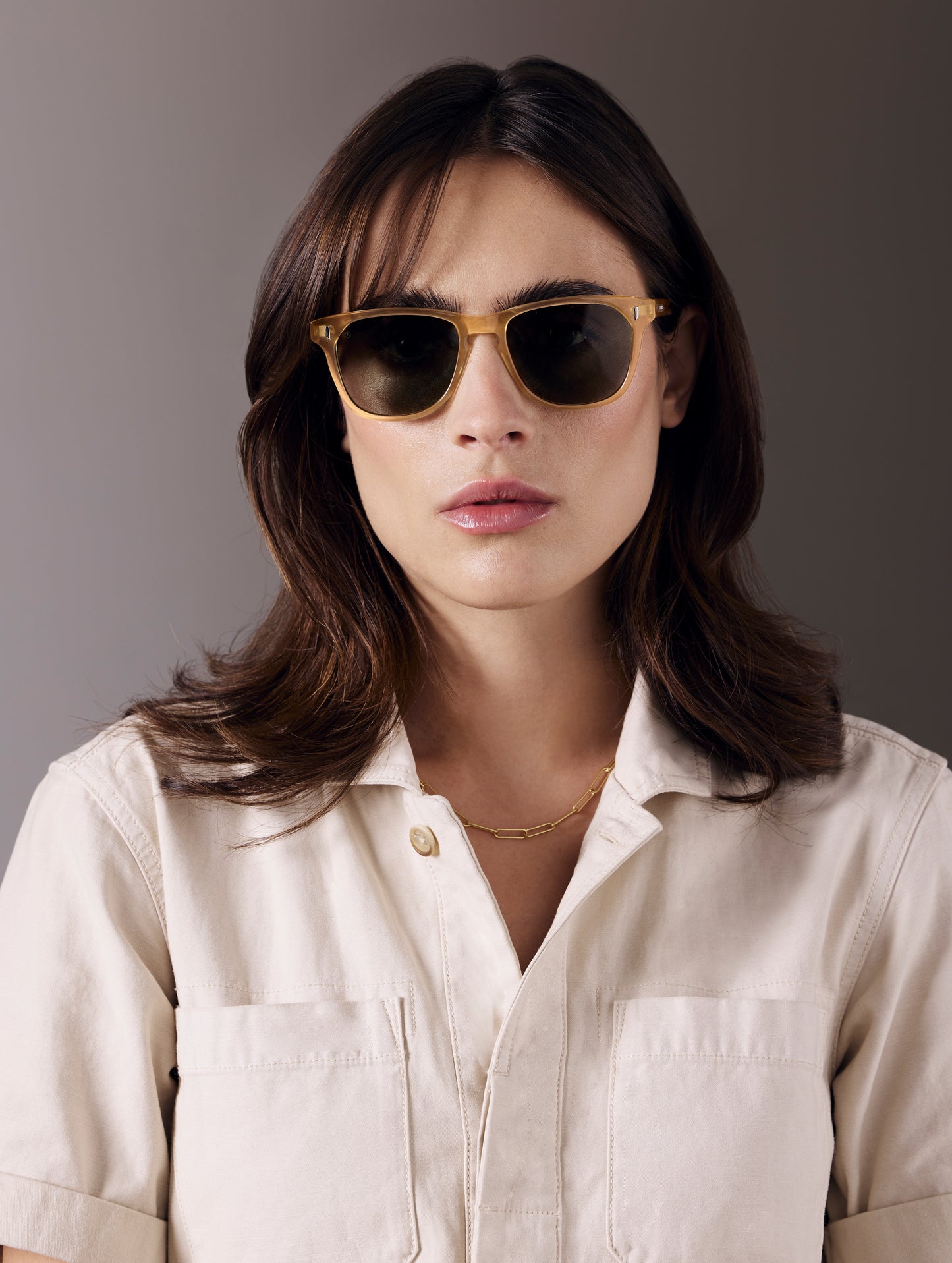 Front view of woman wearing Yosemite Sunglass in Honey with G15 Lens from AETHER Apparel.