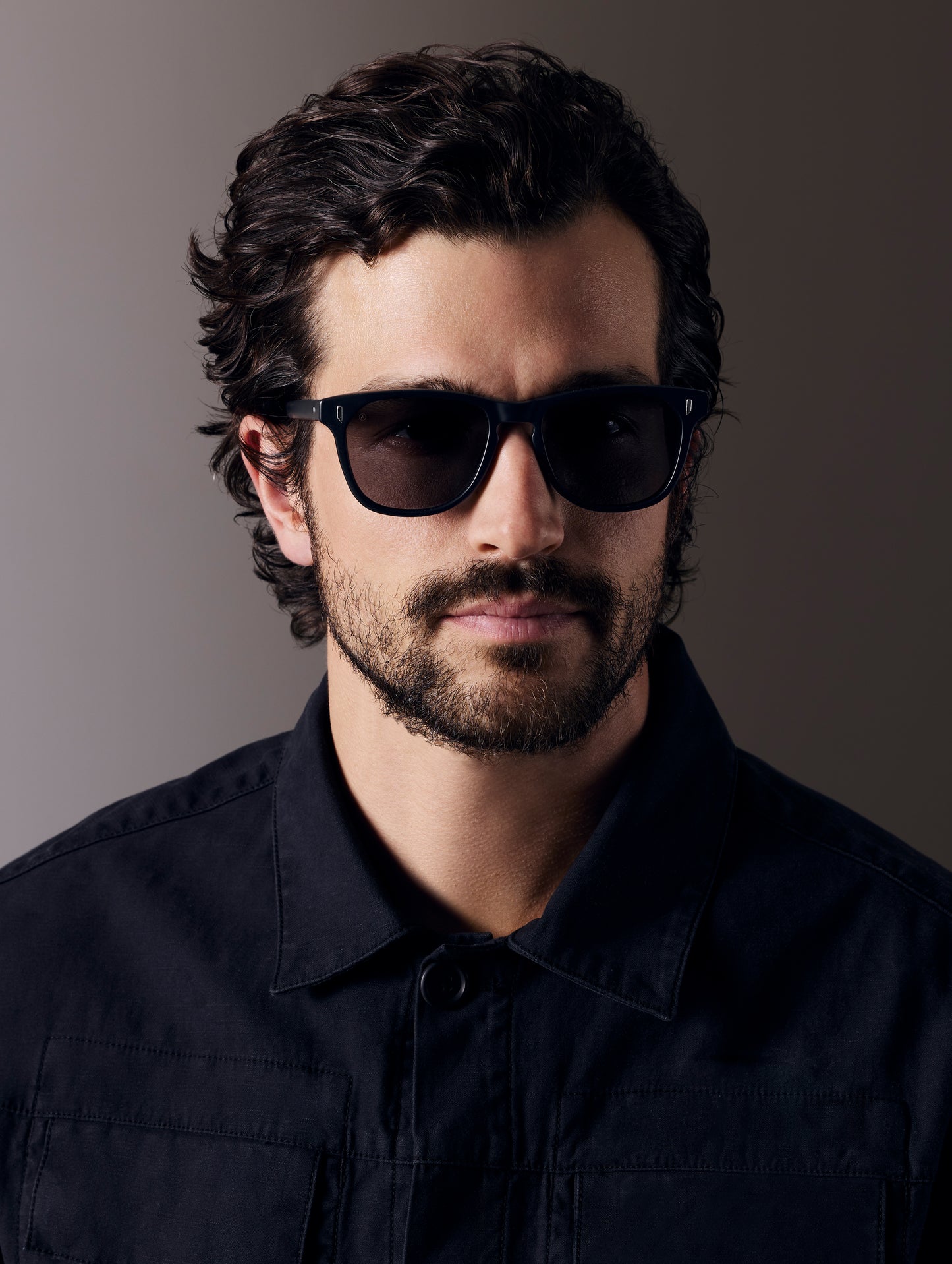 Front view of man wearing Yosemite Sunglass in Matte Black with Grey Lens from AETHER Apparel.