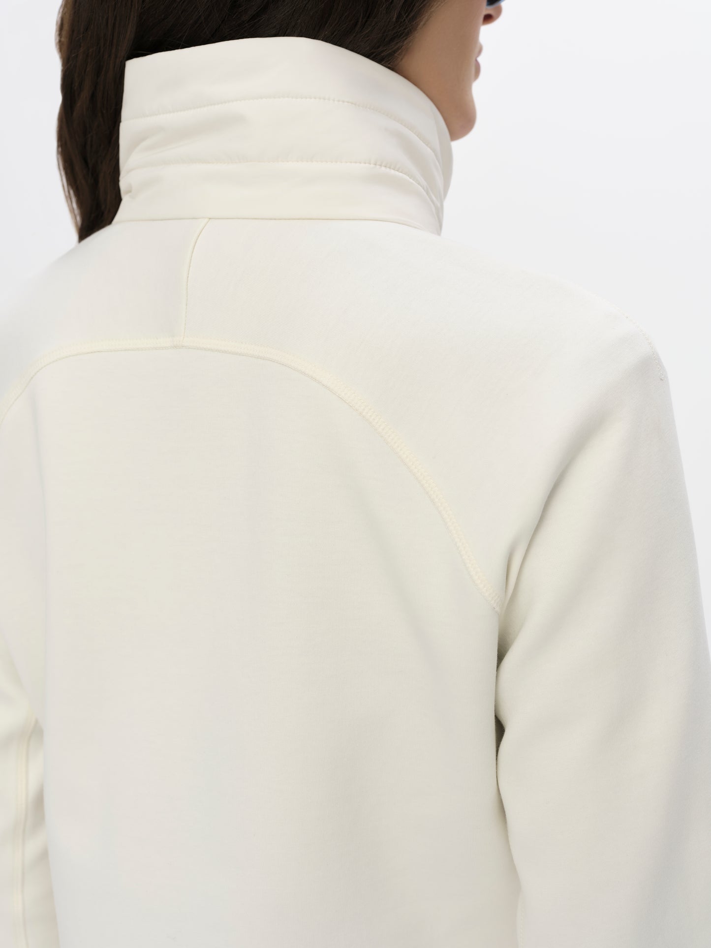 Closeup detailed view of the collar, shoulders, and back of the W Morgan Full-Zip 2.0 in Winter White from AETHER Apparel.
