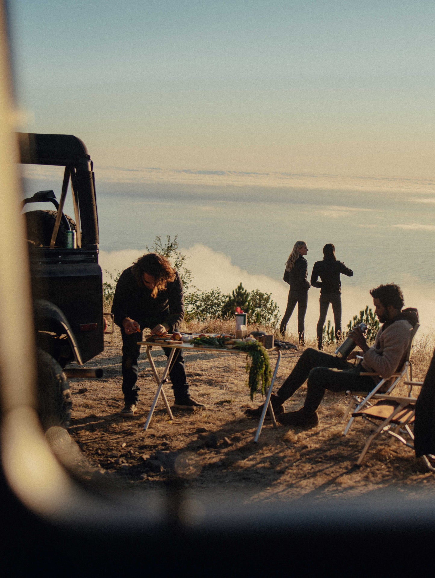 A group of people gathered near a body of water.