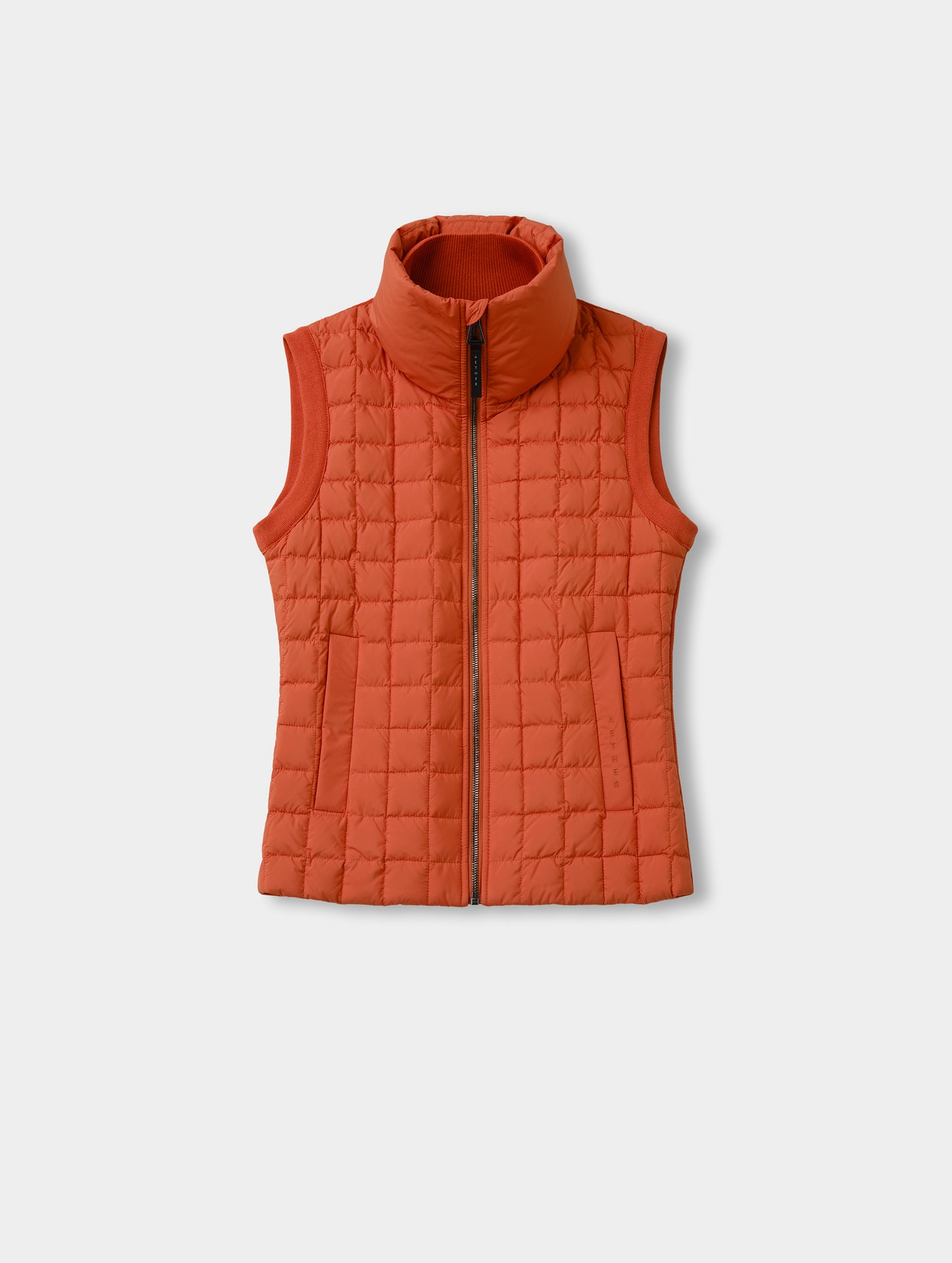 Flat lay view of the front of the Phase Vest in Madeira Orange from AETHER Apparel.