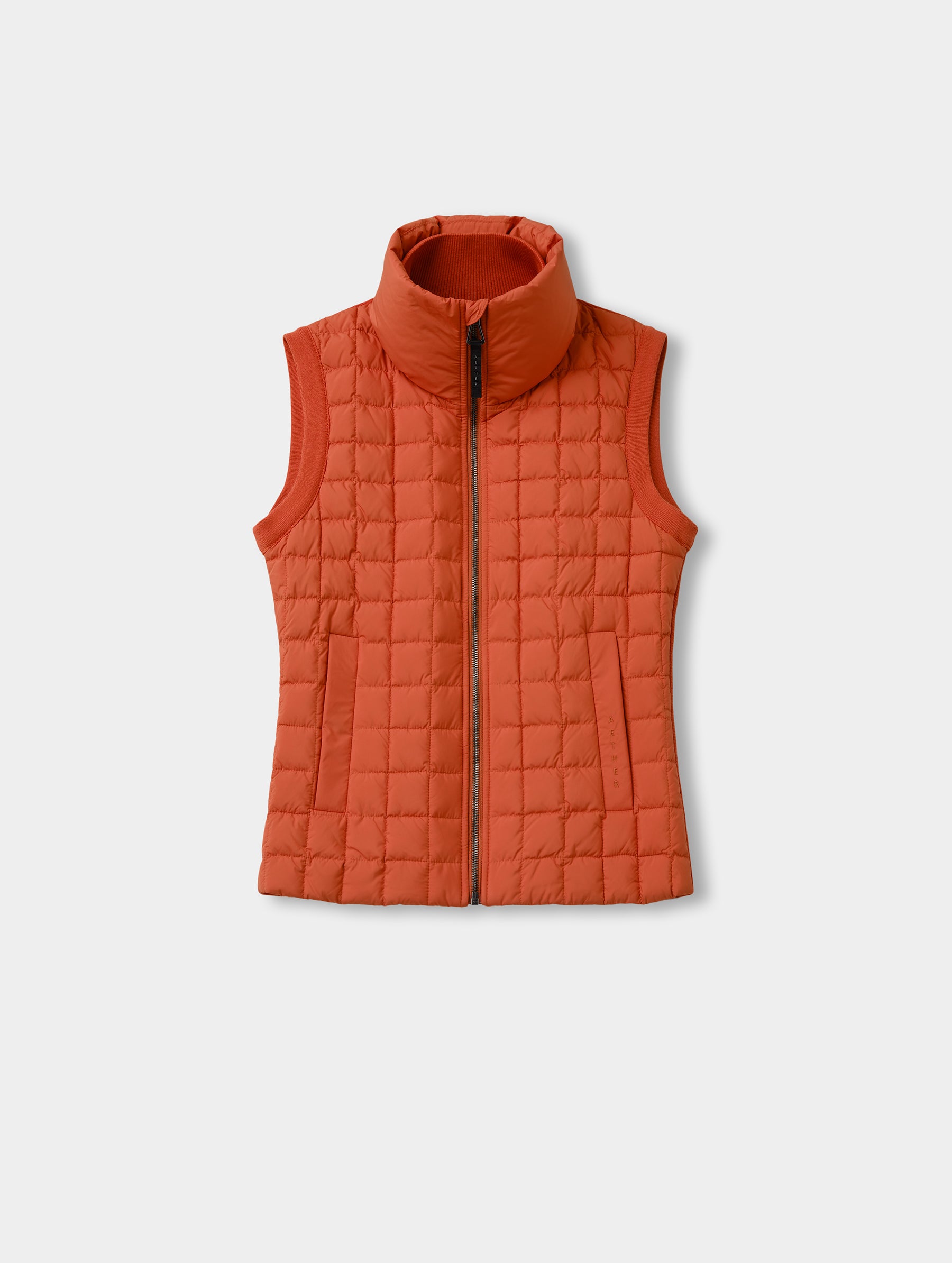 Flat lay view of the front of the Phase Vest in Madeira Orange from AETHER Apparel.