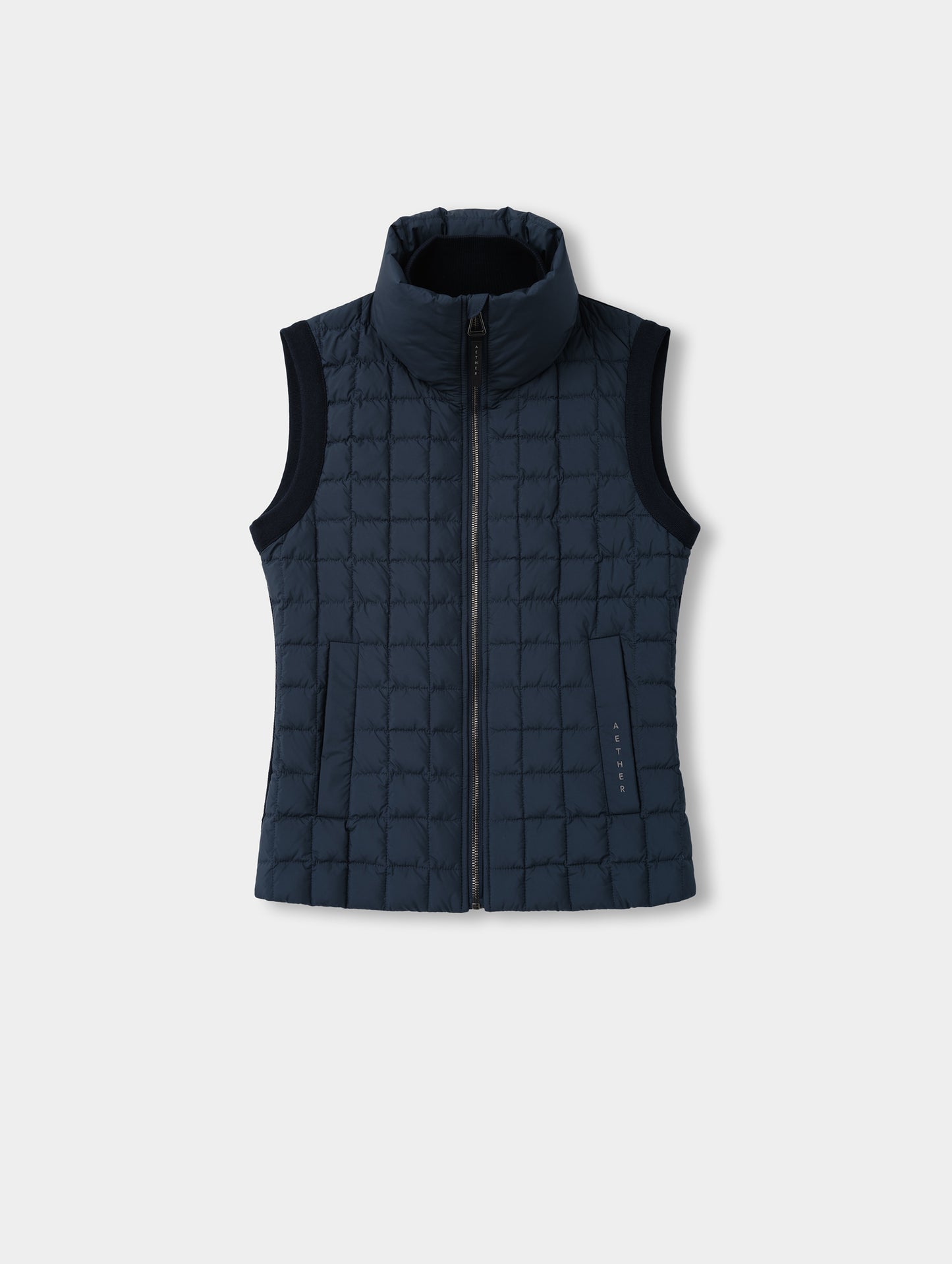 Flat lay view of the front of the Phase Vest in Total Eclipse from AETHER Apparel.