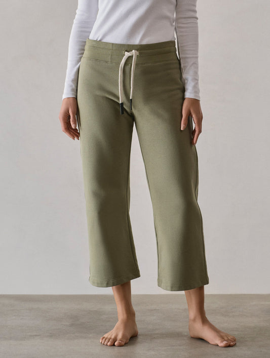 Front full-body view of woman wearing W Osa Cropped Sweatpant in Fern Green from AETHER Apparel.