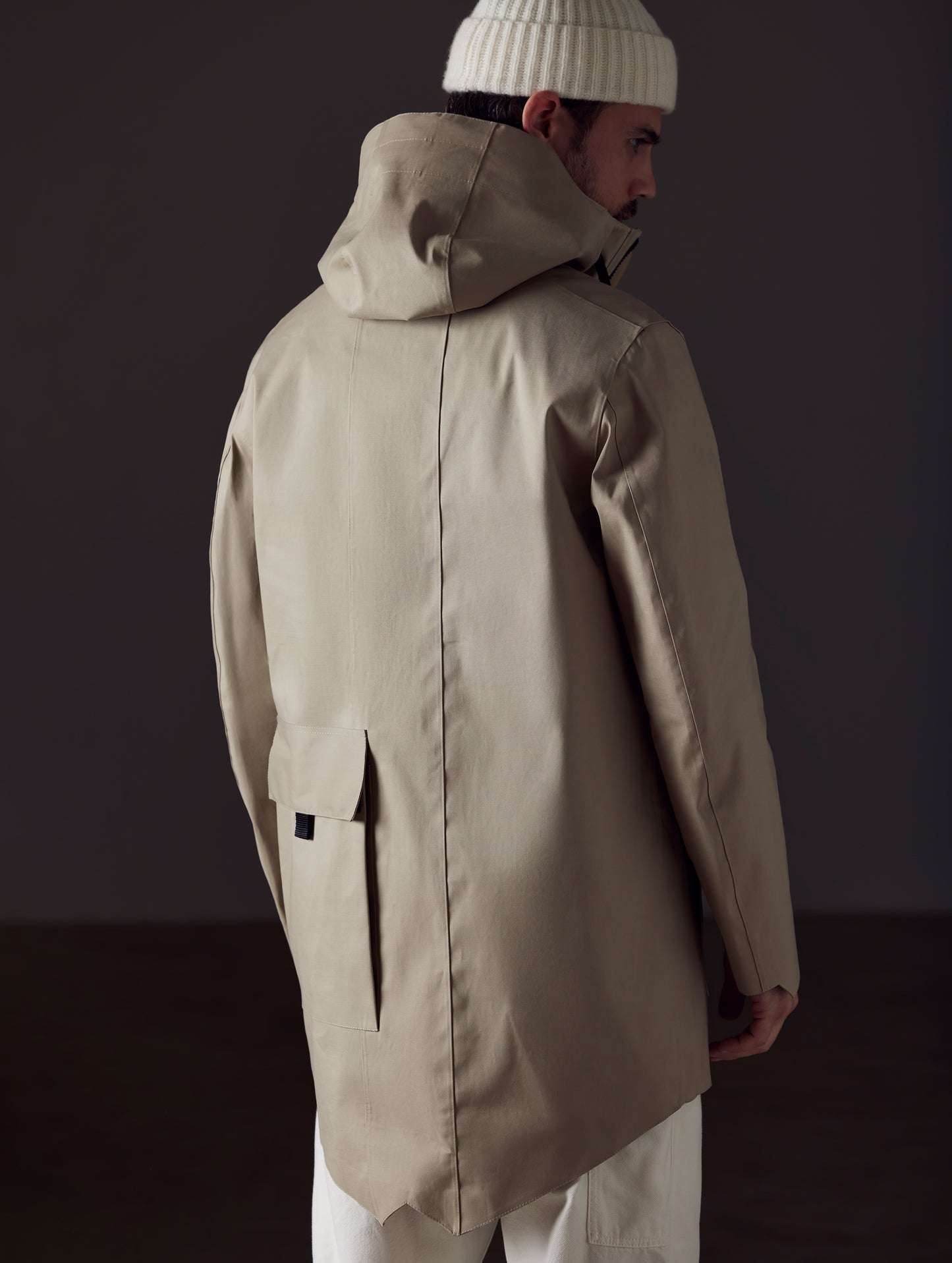 Back view of man wearing beige parka from AETHER Apparel