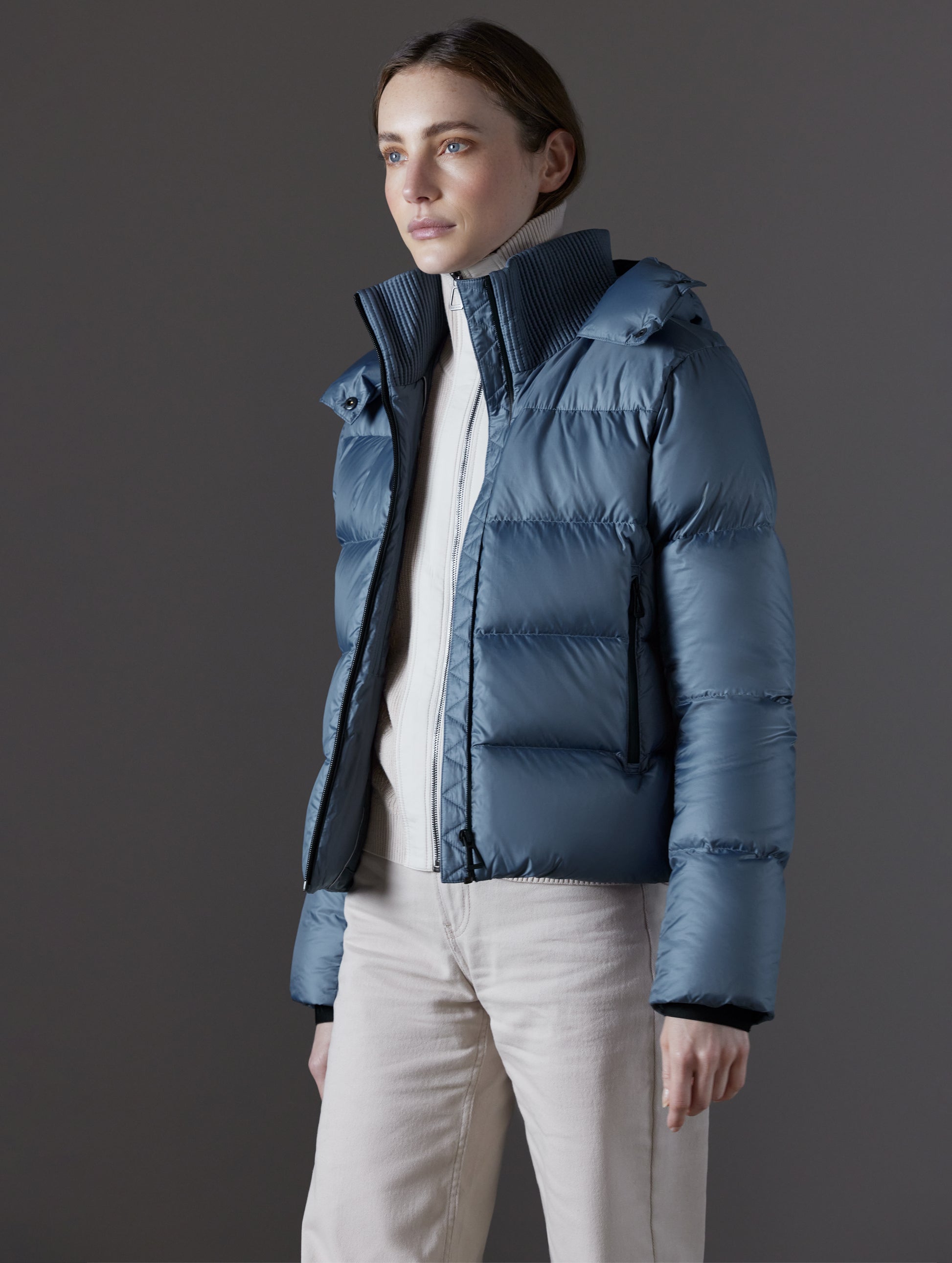 woman wearing blue puffer jacket from AETHER Apparel