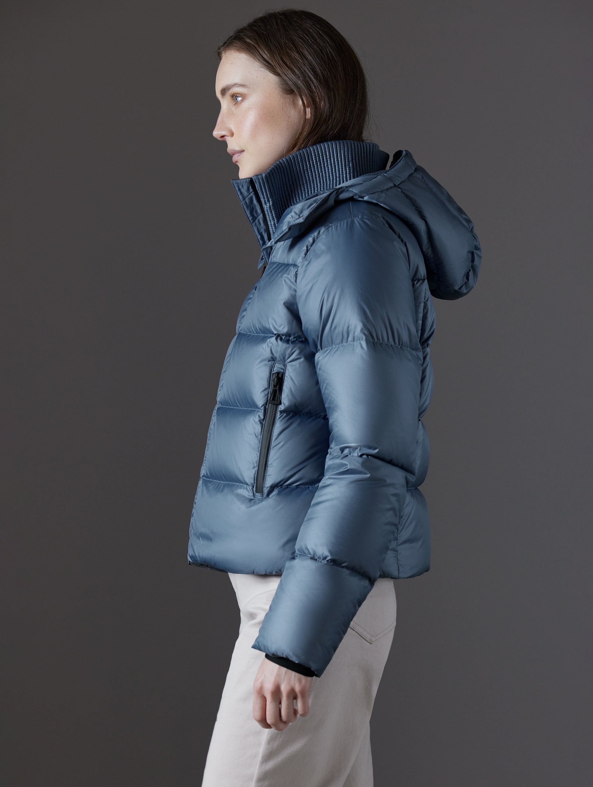 woman wearing blue puffer jacket from AETHER Apparel