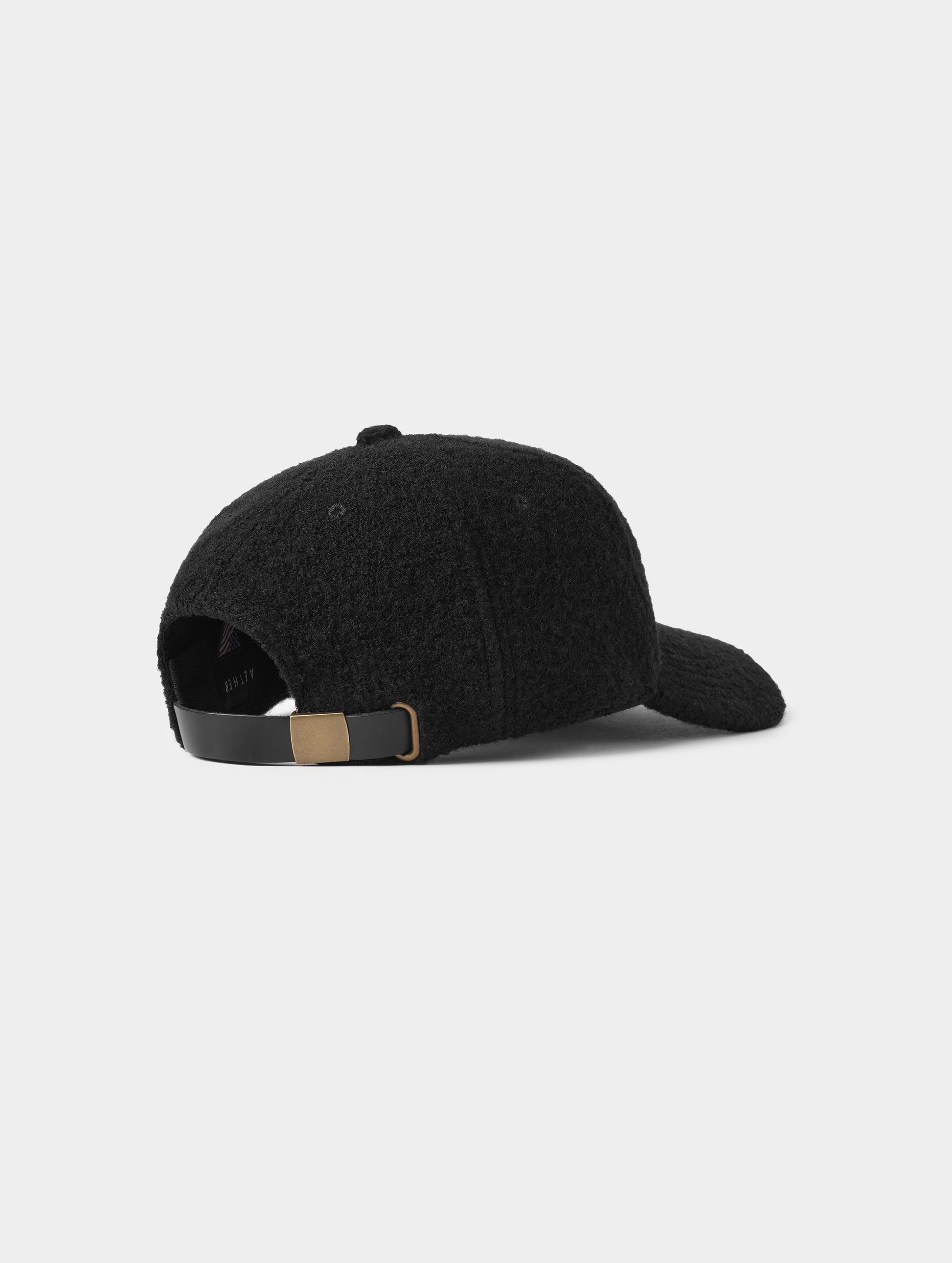 Rear angled view of Aura Wool Hat in Onyx Black from AETHER Apparel. 