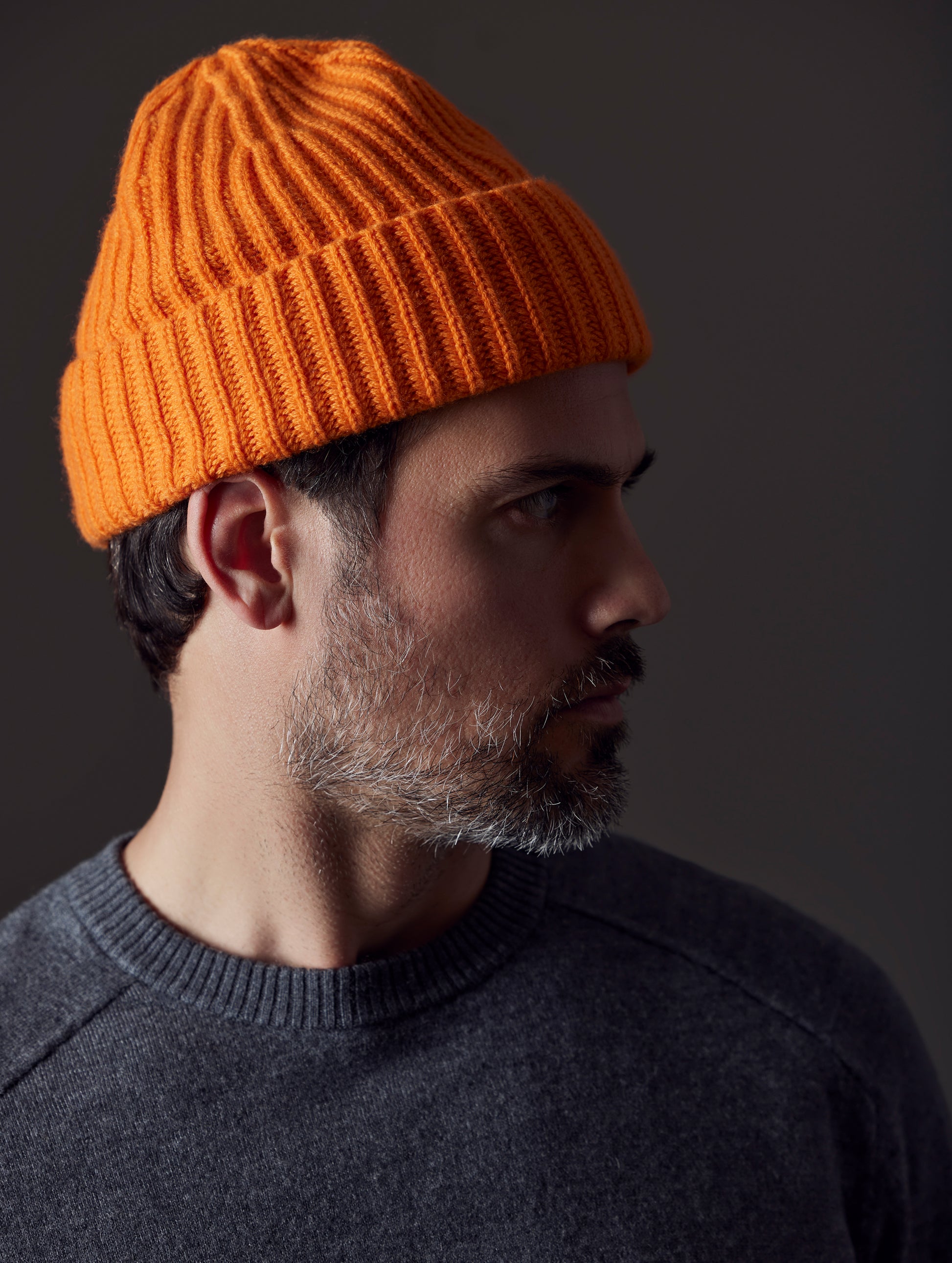 man wearing orange cashmere hat from AETHER Apparel