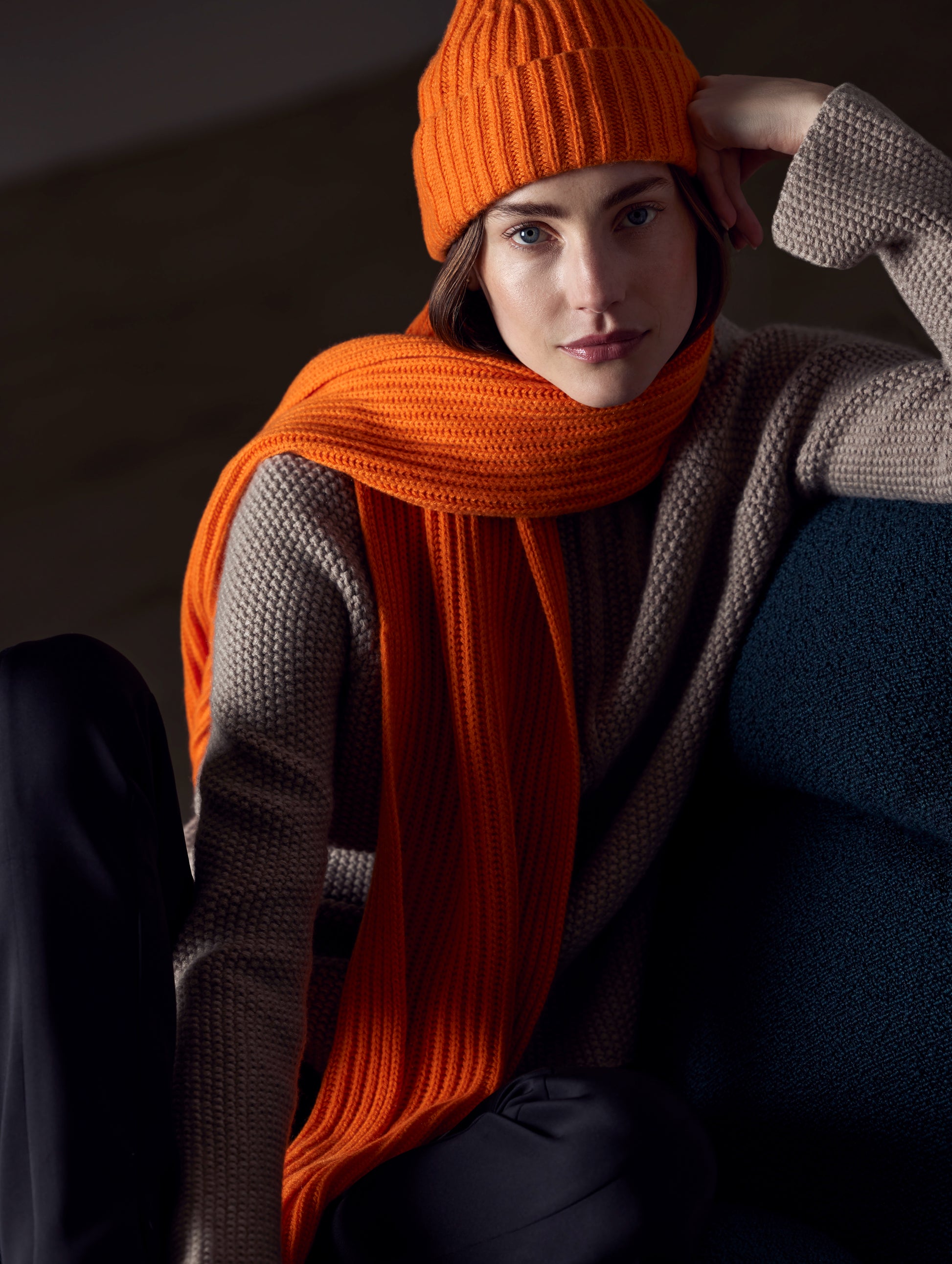 woman wearing orange cashmere hat from AETHER Apparel