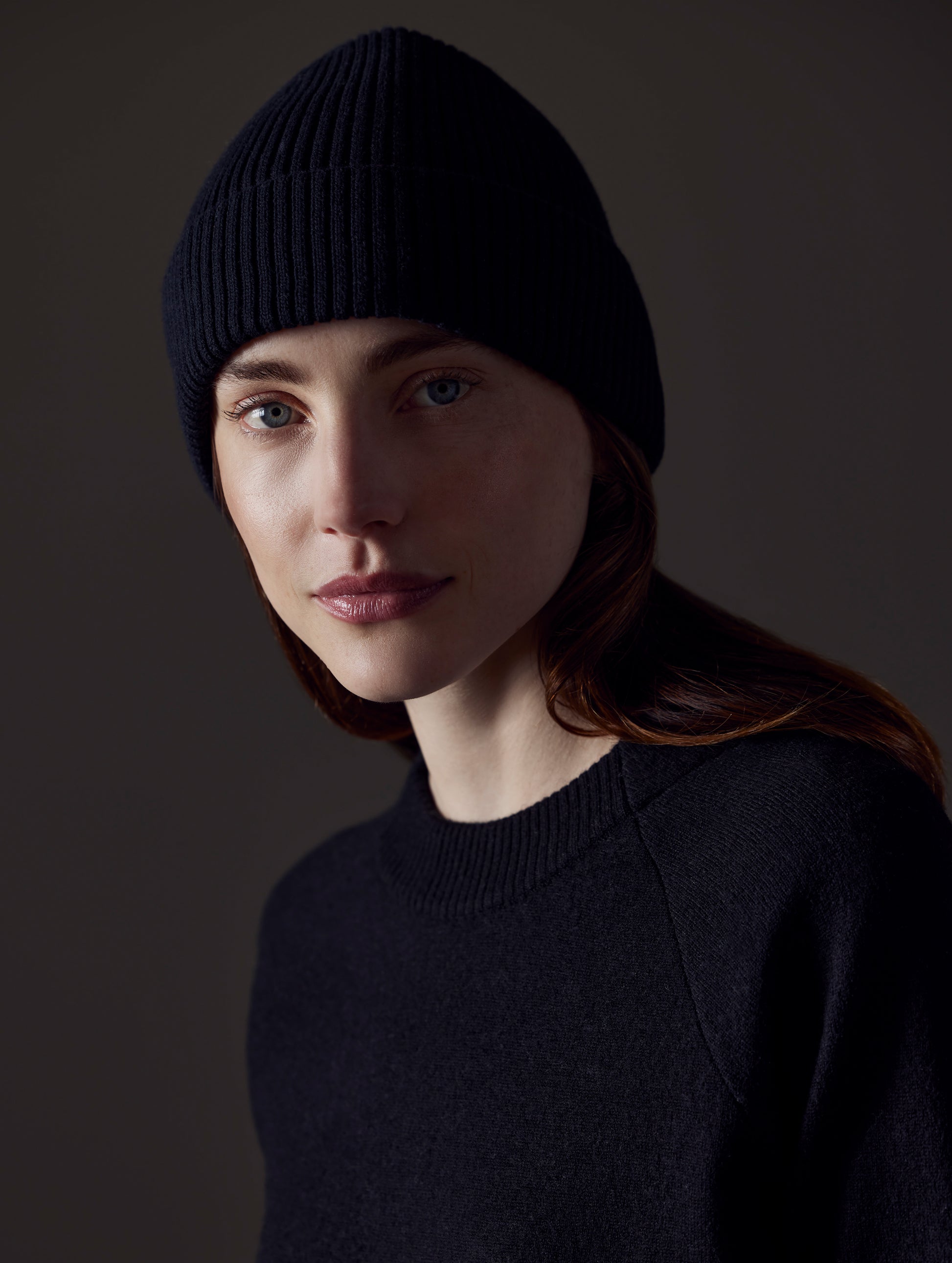woman wearing black cotton beanie from AETHER Apparel