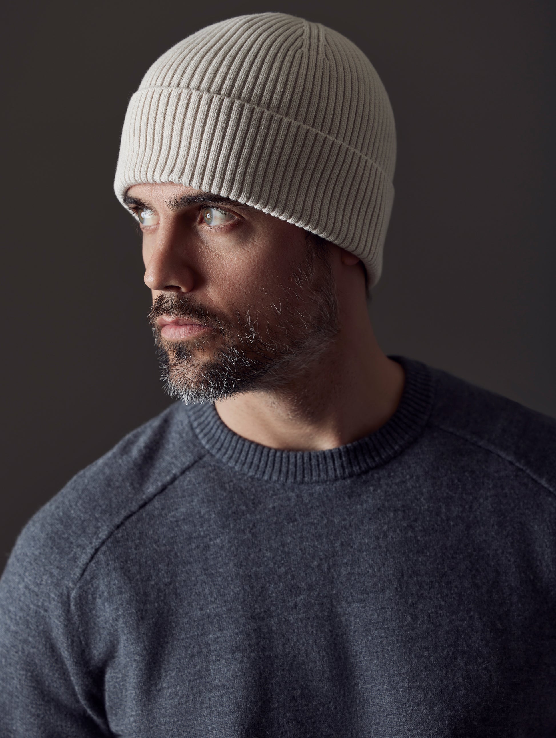 man wearing white cotton beanie from AETHER Apparel