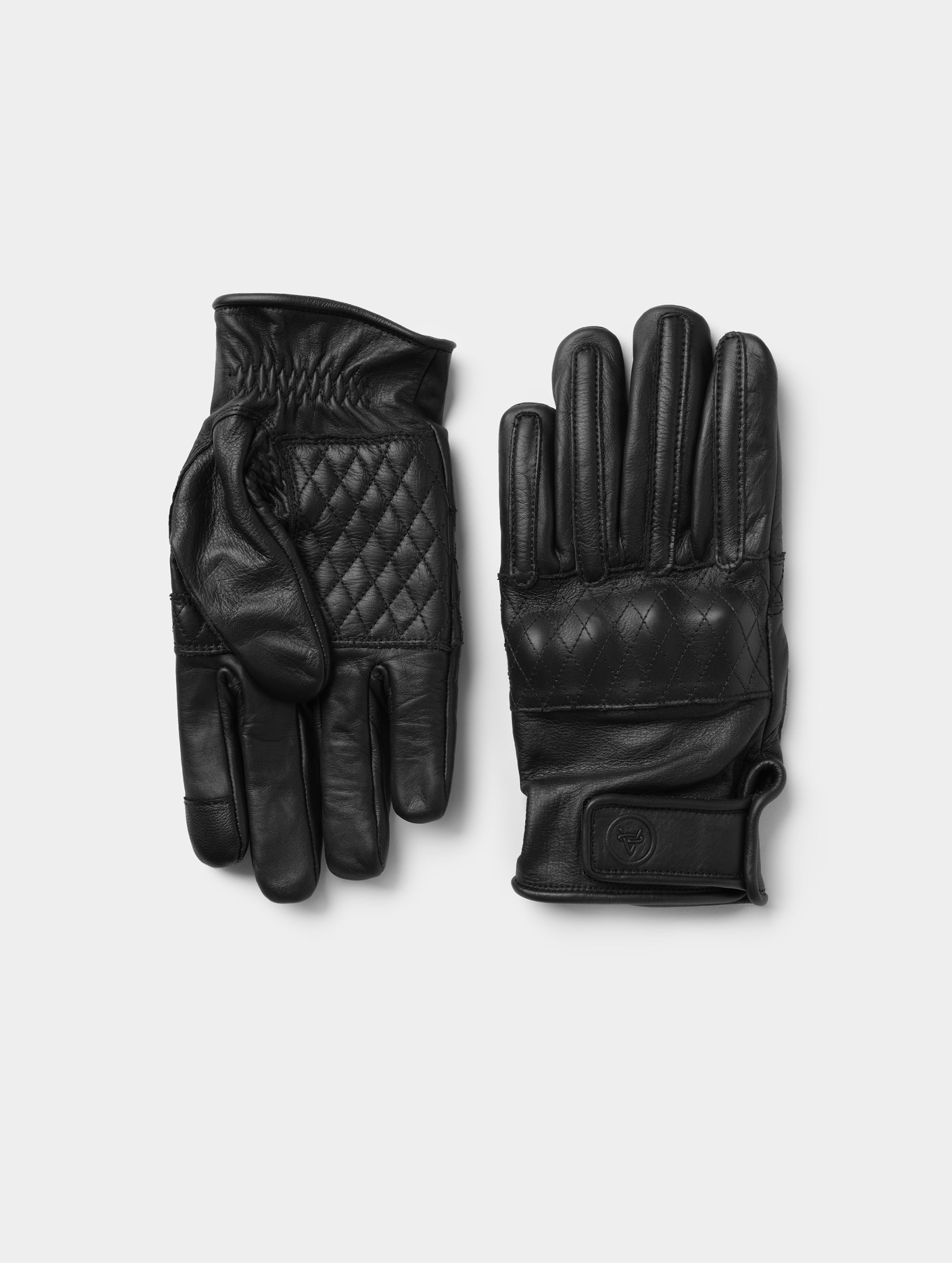 Flat lay view of the top and bottom of the Circuit Moto Glove in Onyx Black from AETHER Apparel. 