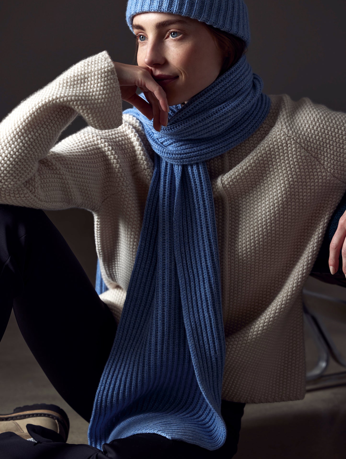 woman wearing light blue cashmere scarf from AETHER Apparel