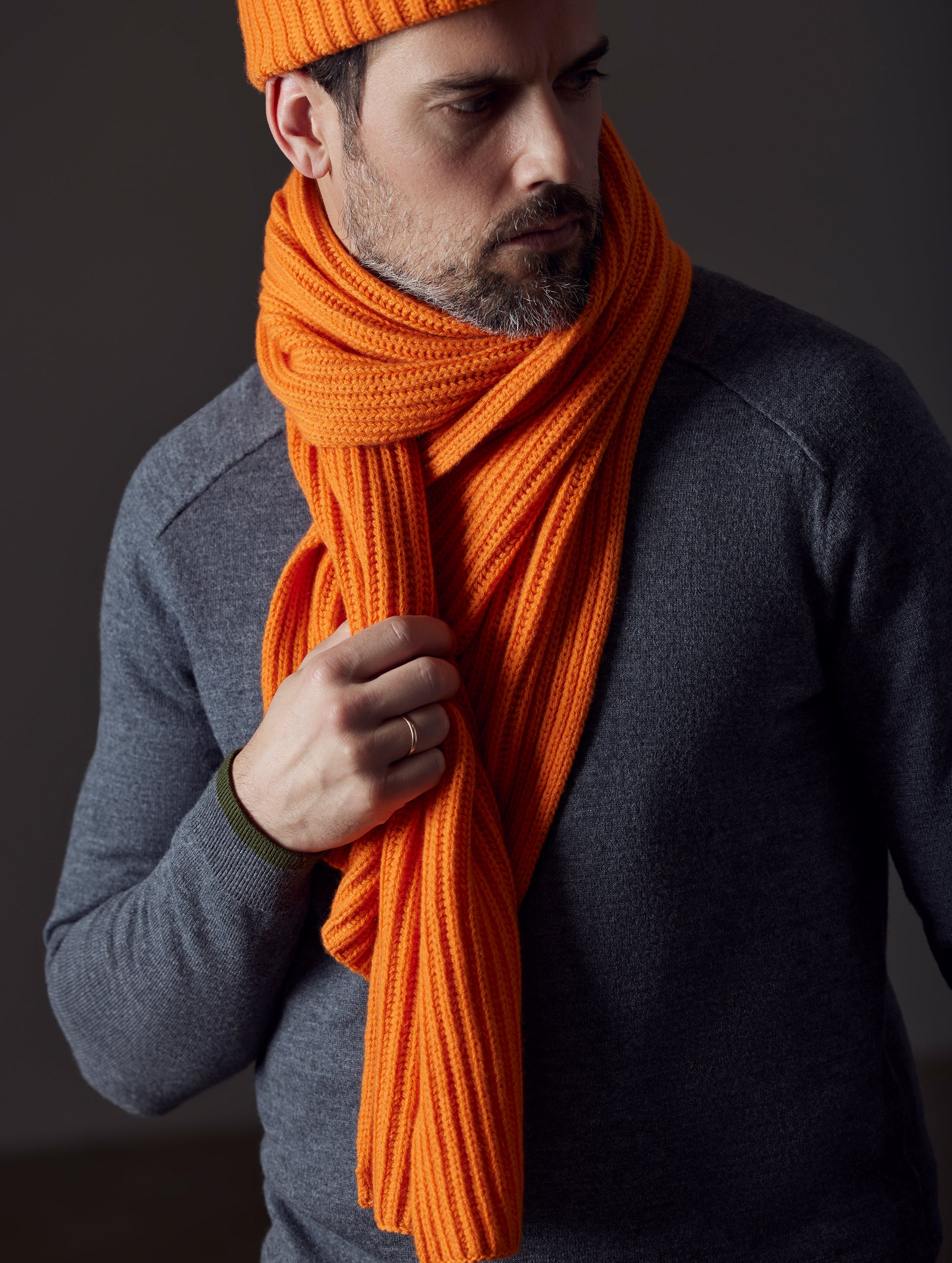 man wearing orange cashmere scarf from AETHER Apparel