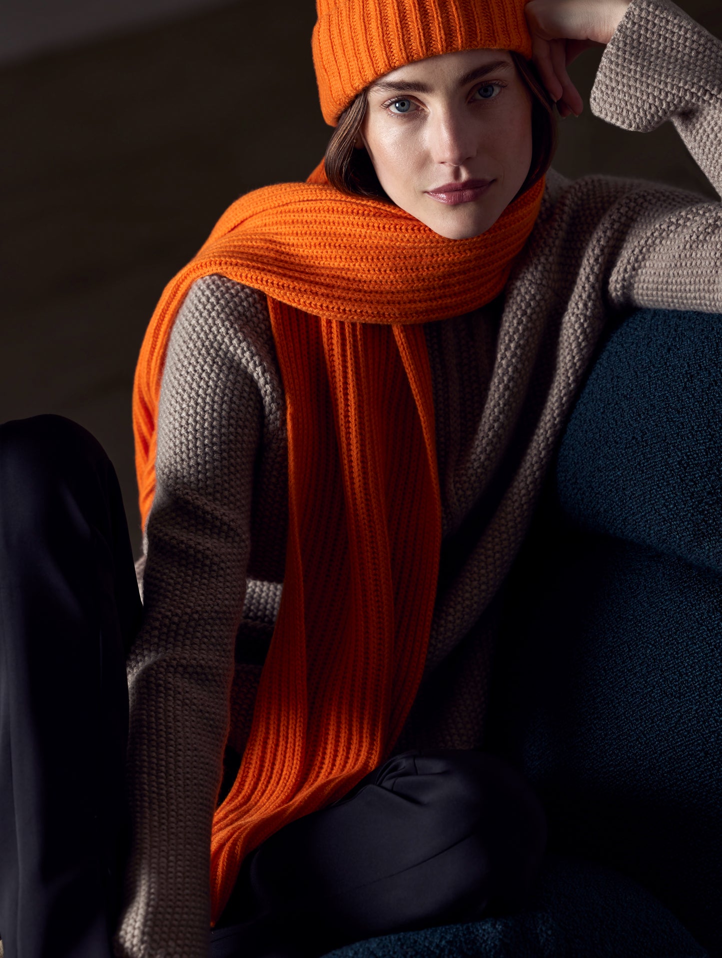 woman wearing orange cashmere scarf from AETHER Apparel