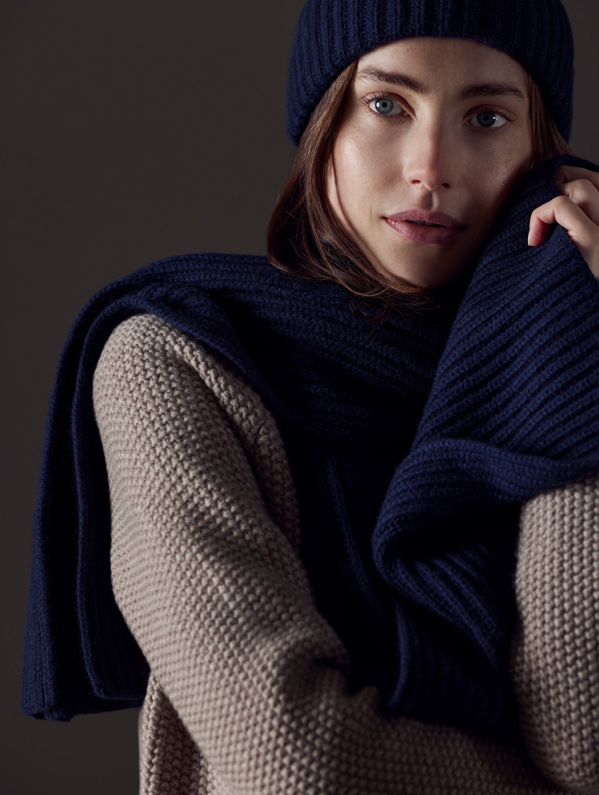 woman wearing dark blue cashmere hat and scarf from AETHER Apparel