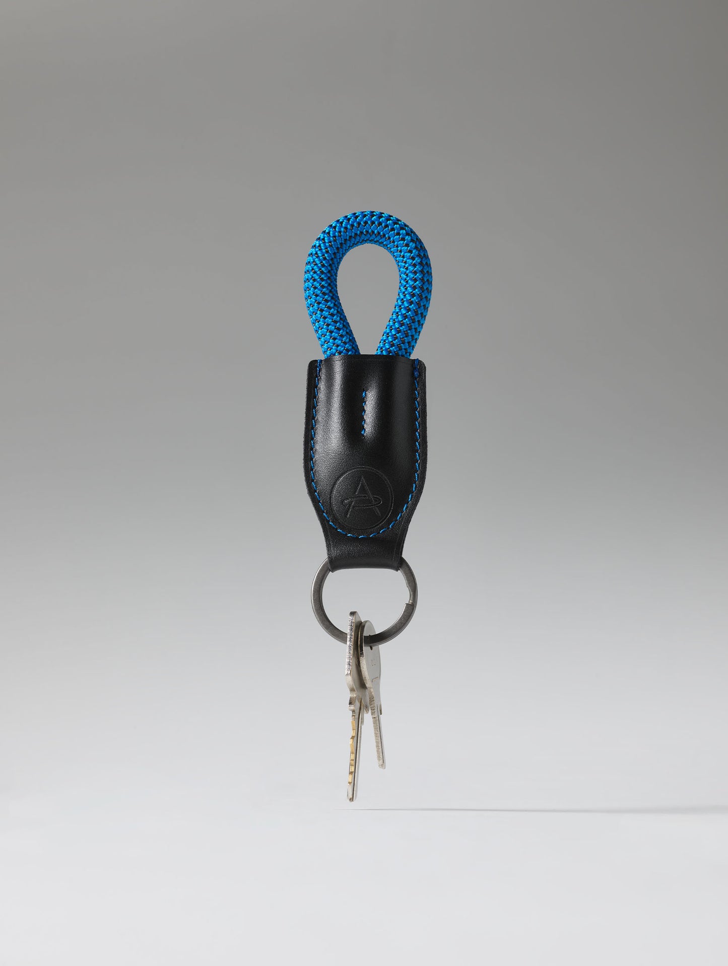 Studio image of AETHER Rope Keychain with keys.