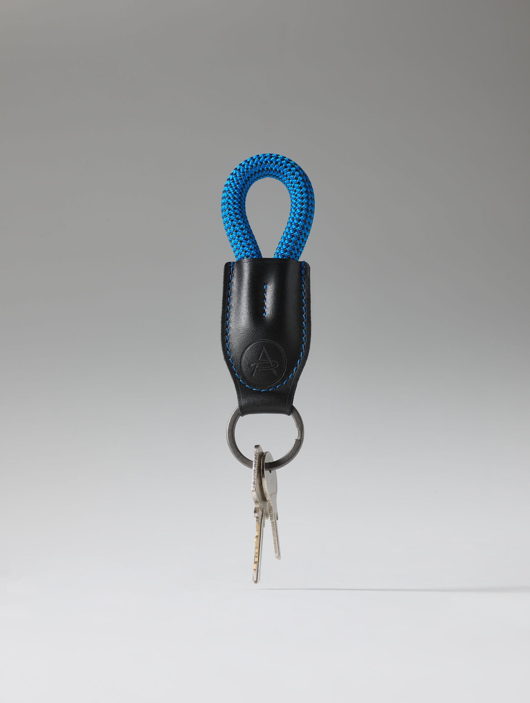 Studio image of AETHER Rope Keychain with keys.