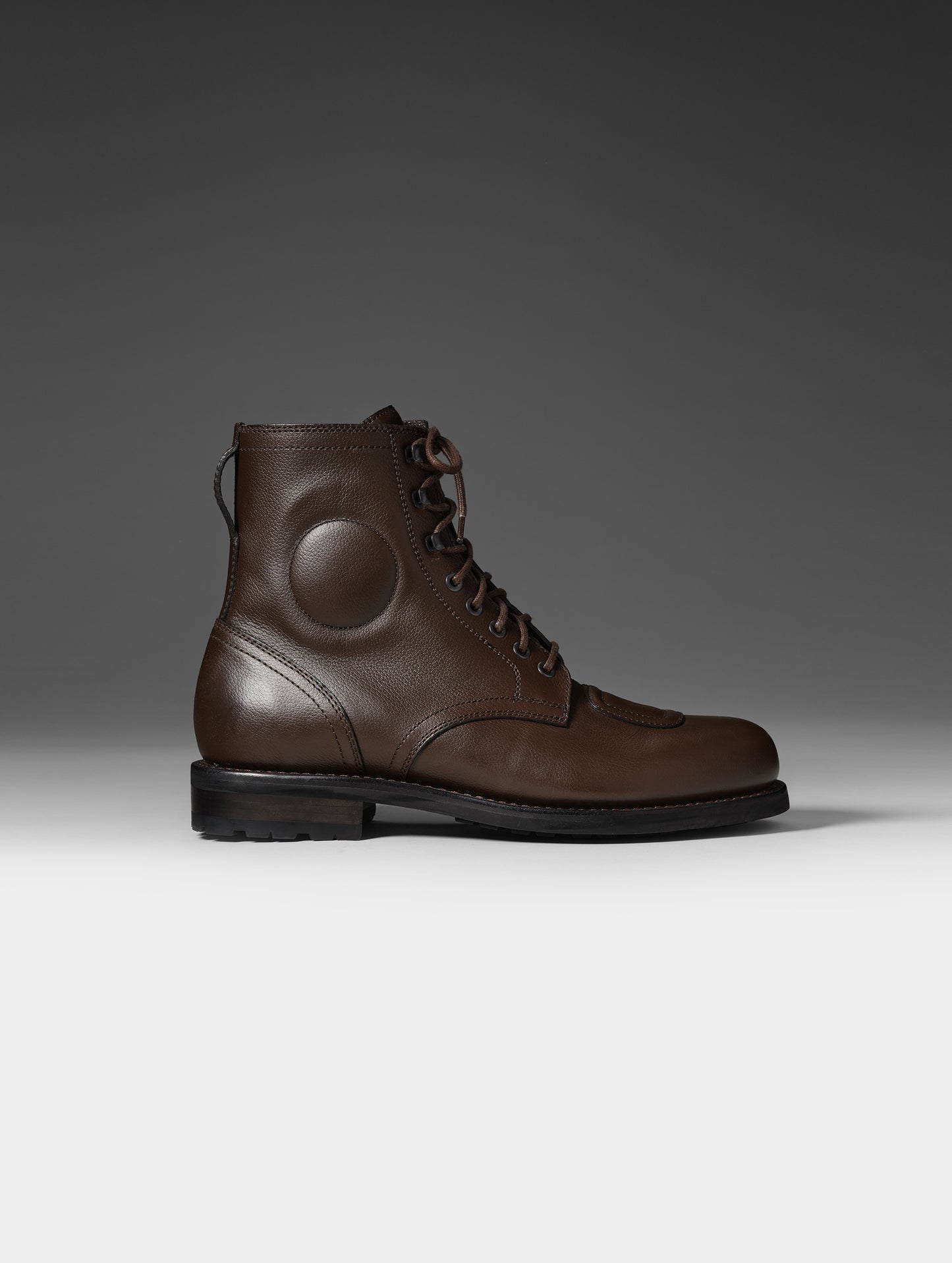 Side, profile studio shot of the Tioga Moto Boot in Espresso Brown with brown laces from AETHER Apparel.
