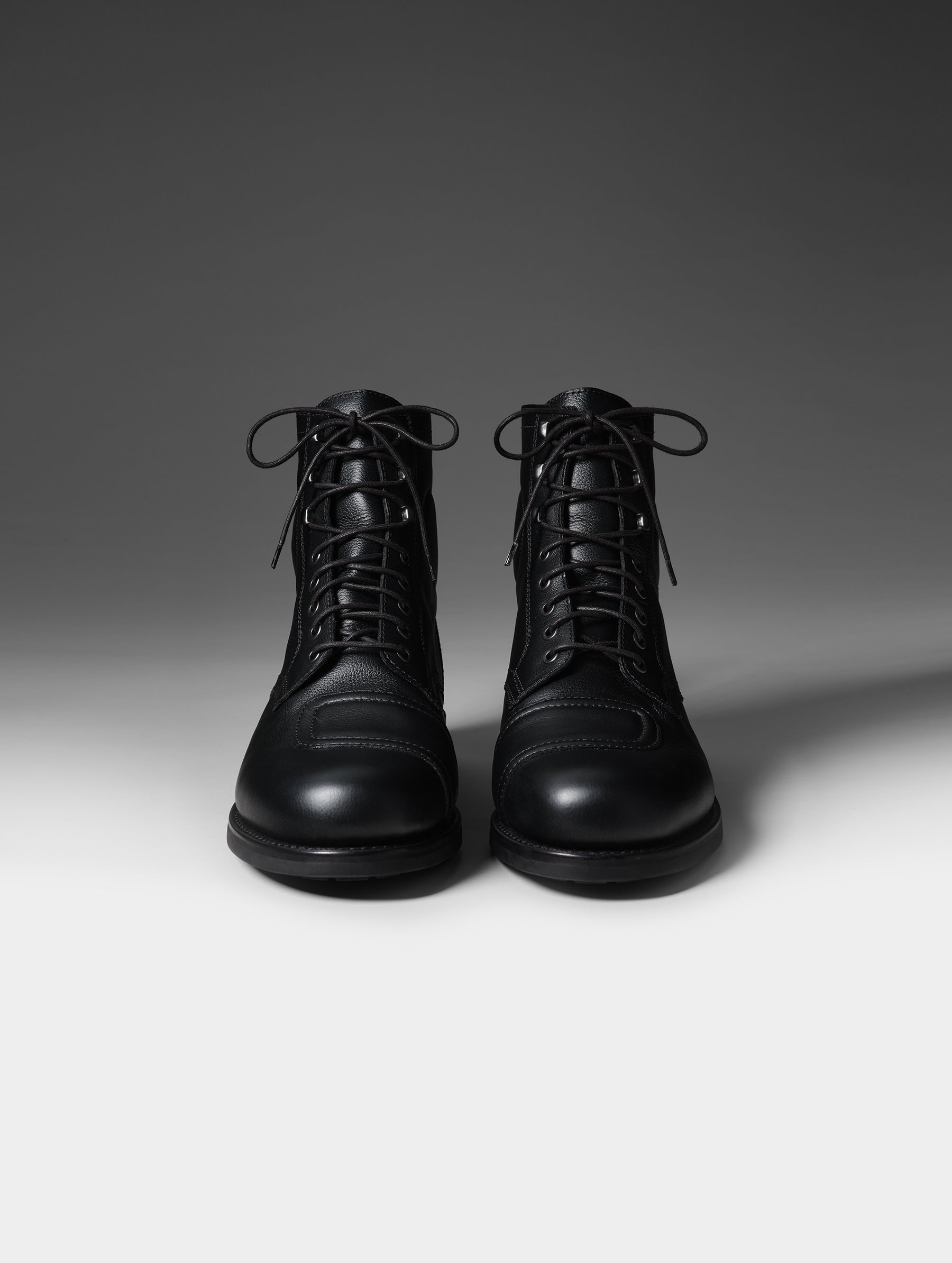 Front studio shot of the Tioga Moto Boot in Onyx Black with black laces from AETHER Apparel.