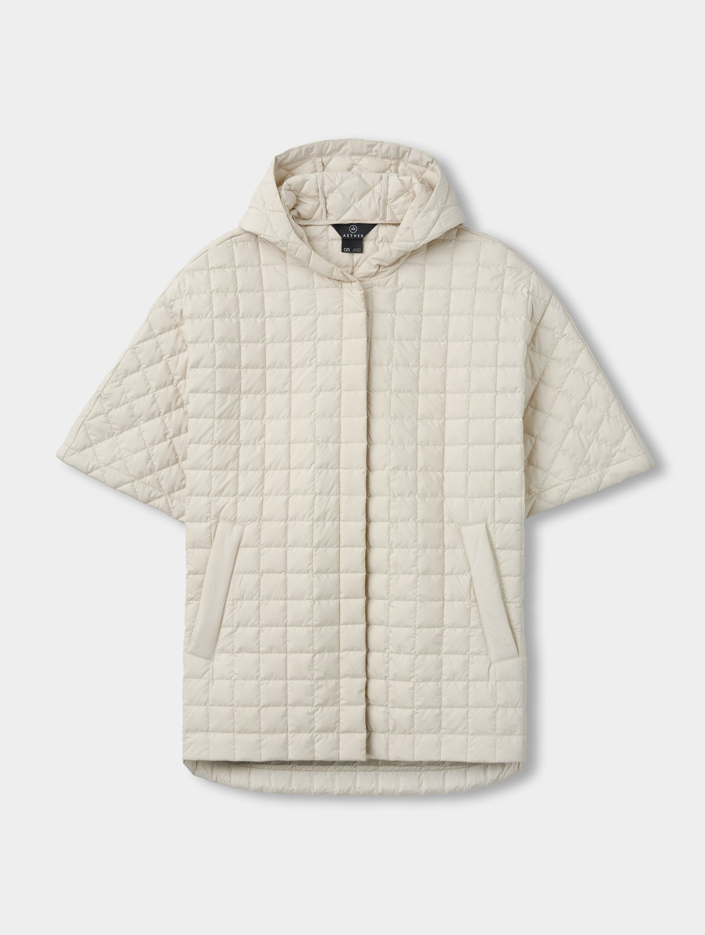 Flat lay view of the Bardo Hooded Poncho in Bone from AETHER Apparel.
