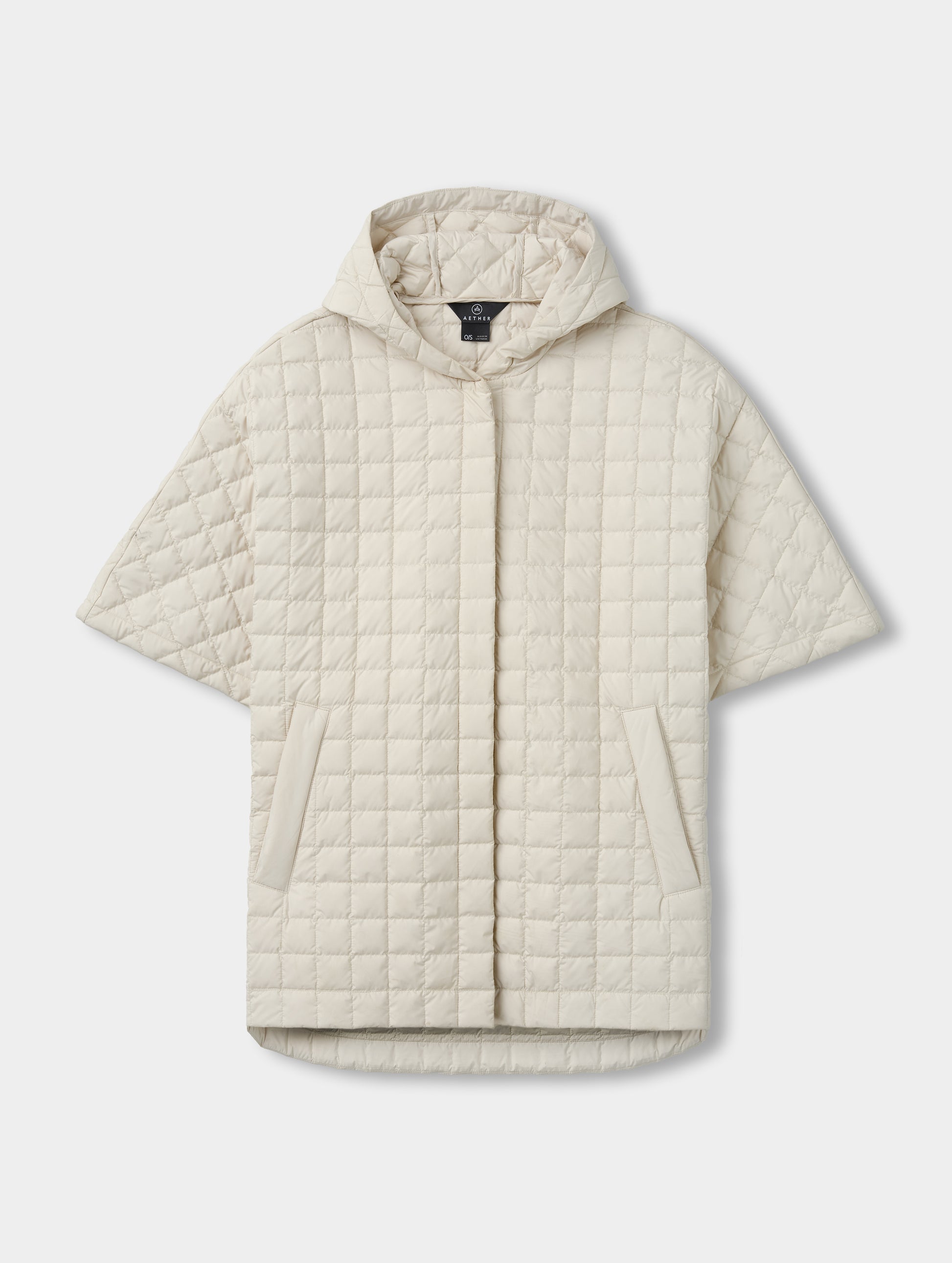 Flat lay view of the Bardo Hooded Poncho in Bone from AETHER Apparel.