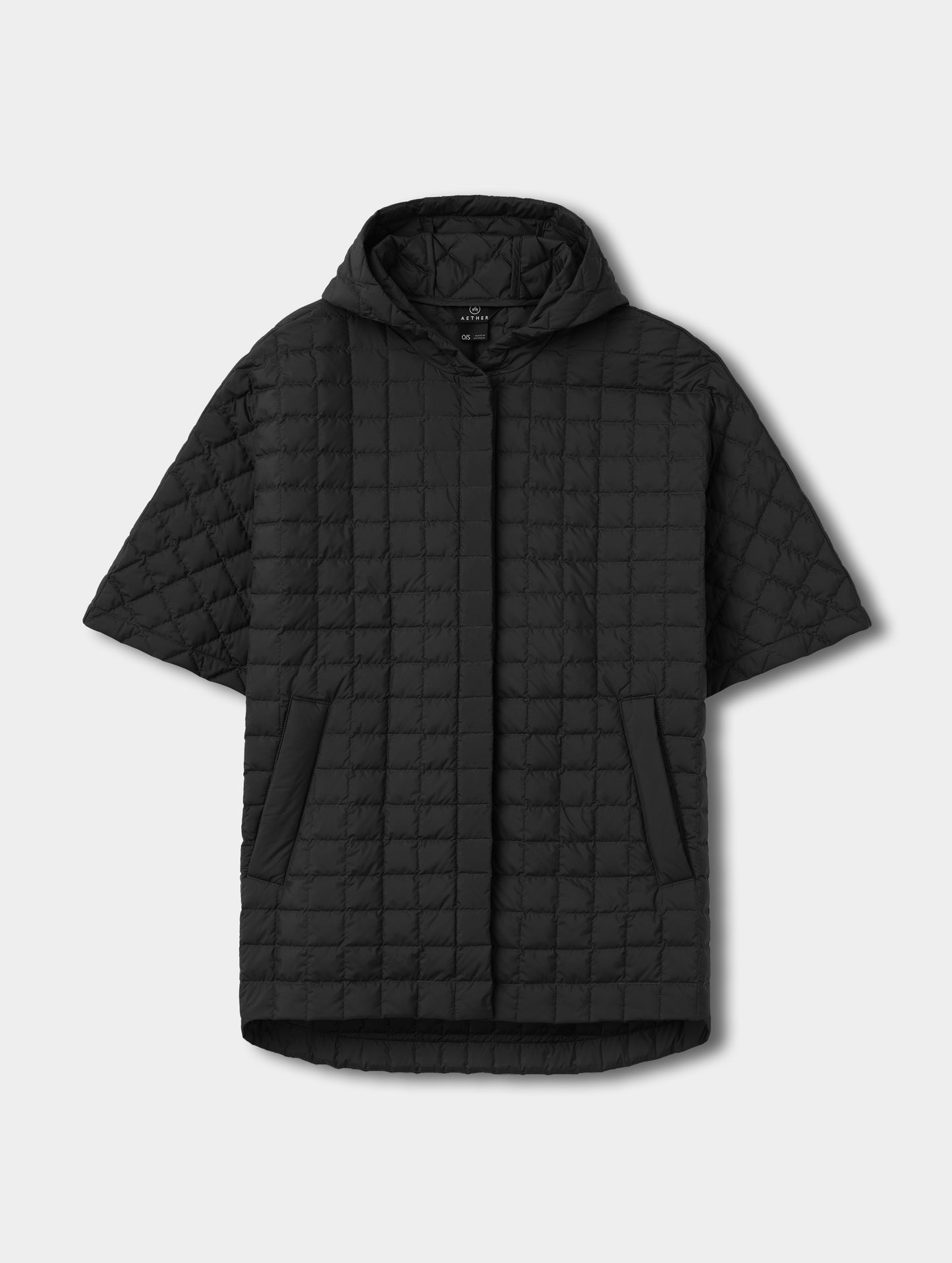 Flat lay view of the Bardo Hooded Poncho in Onyx Black from AETHER Apparel.