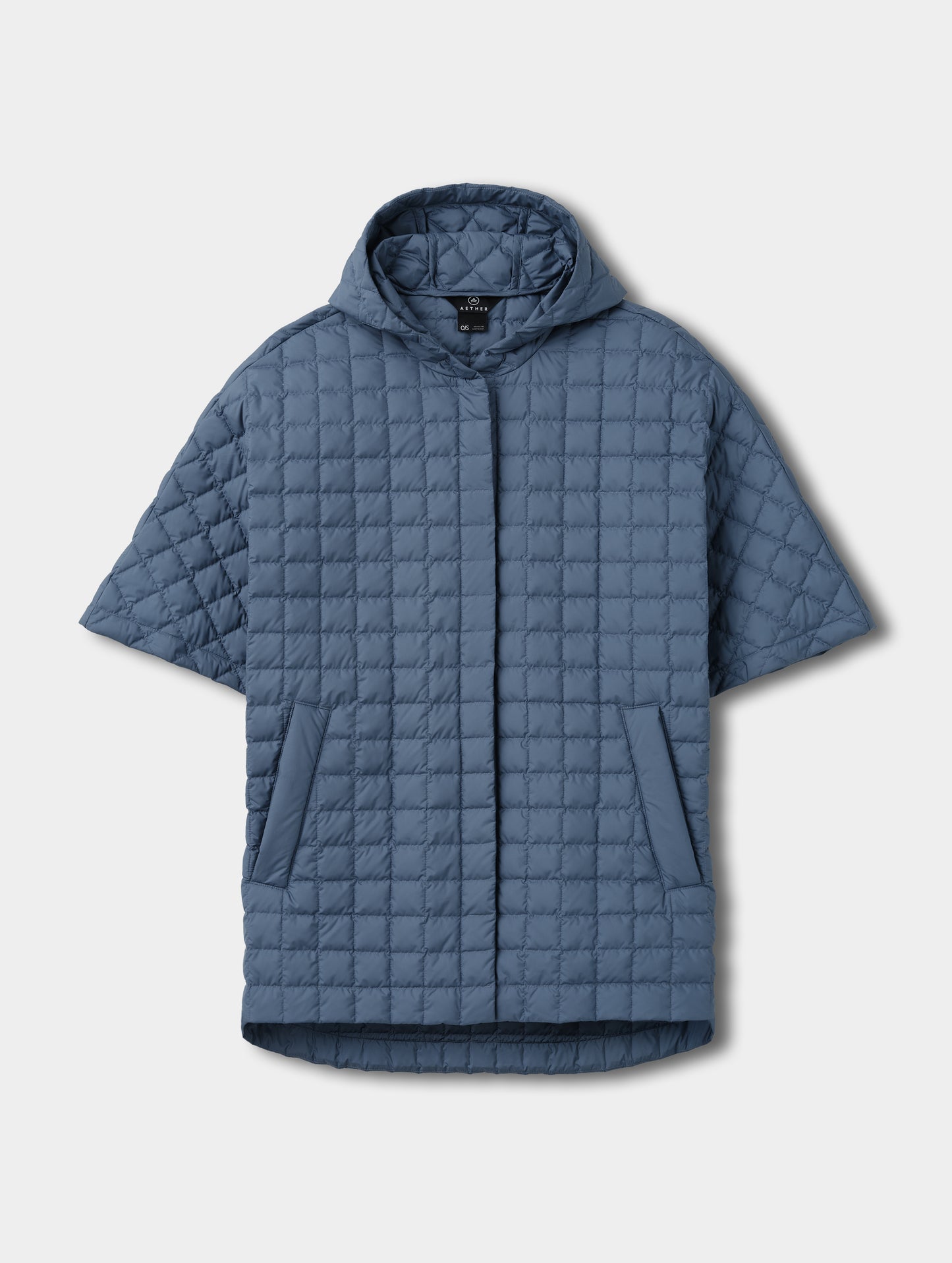 Flat lay view of the Bardo Hooded Poncho in Portal Blue from AETHER Apparel.