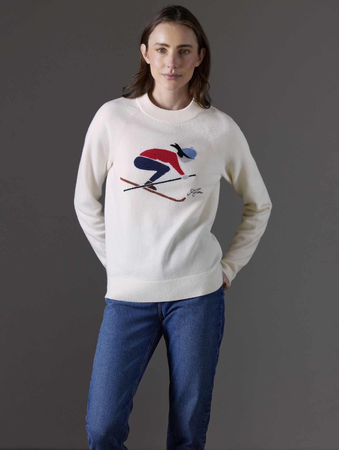 Woman wearing white sweater from AETHER Apparel