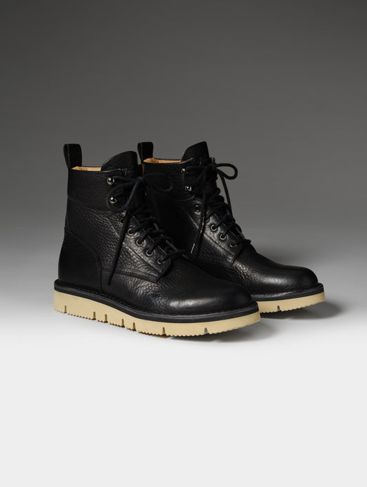 Front 3/4 studio shot of the Canyon Boot in Onyx Black with black laces from AETHER Apparel.
