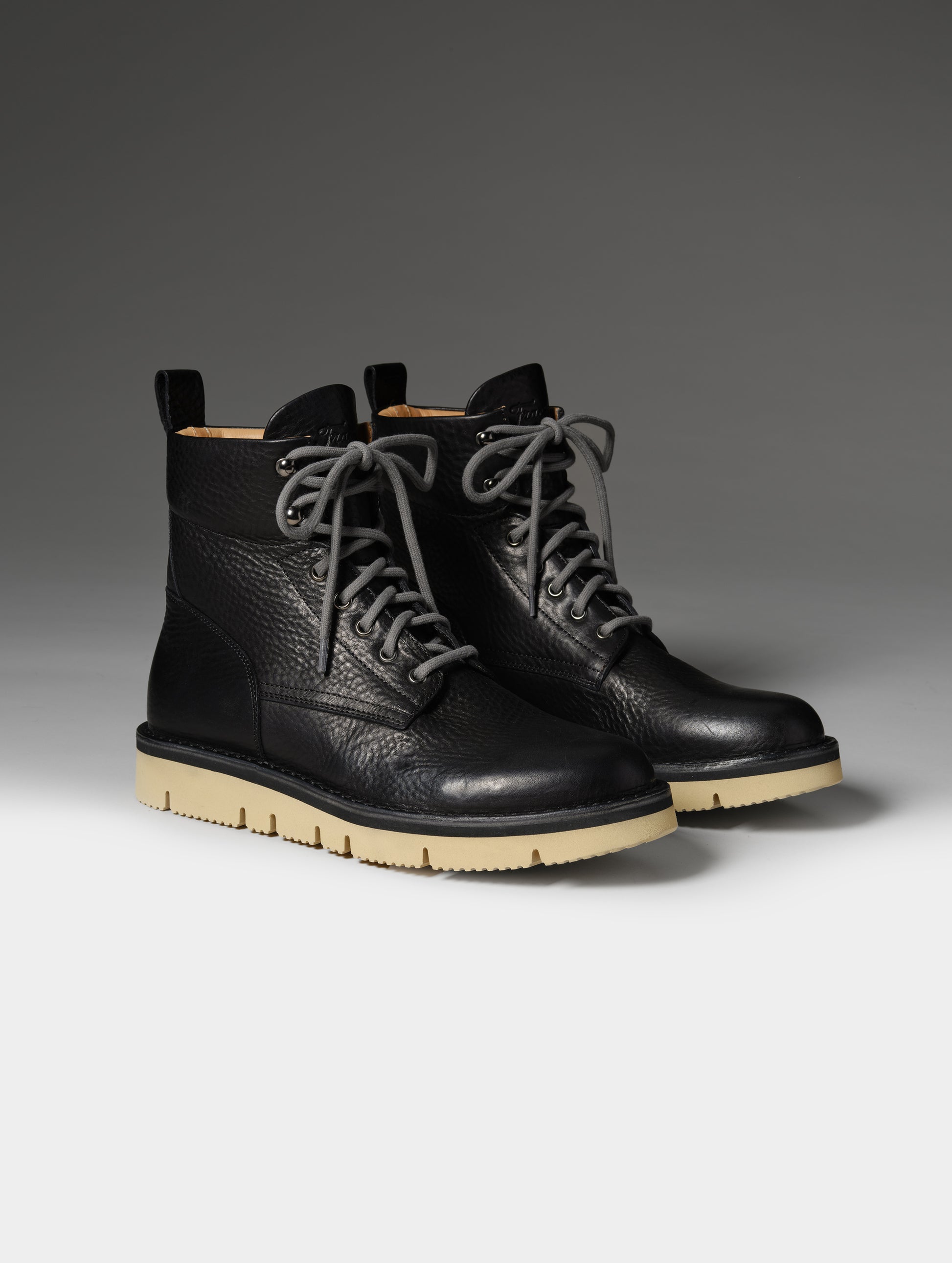 Front 3/4 studio shot of the Canyon Boot in Onyx Black with grey laces from AETHER Apparel.