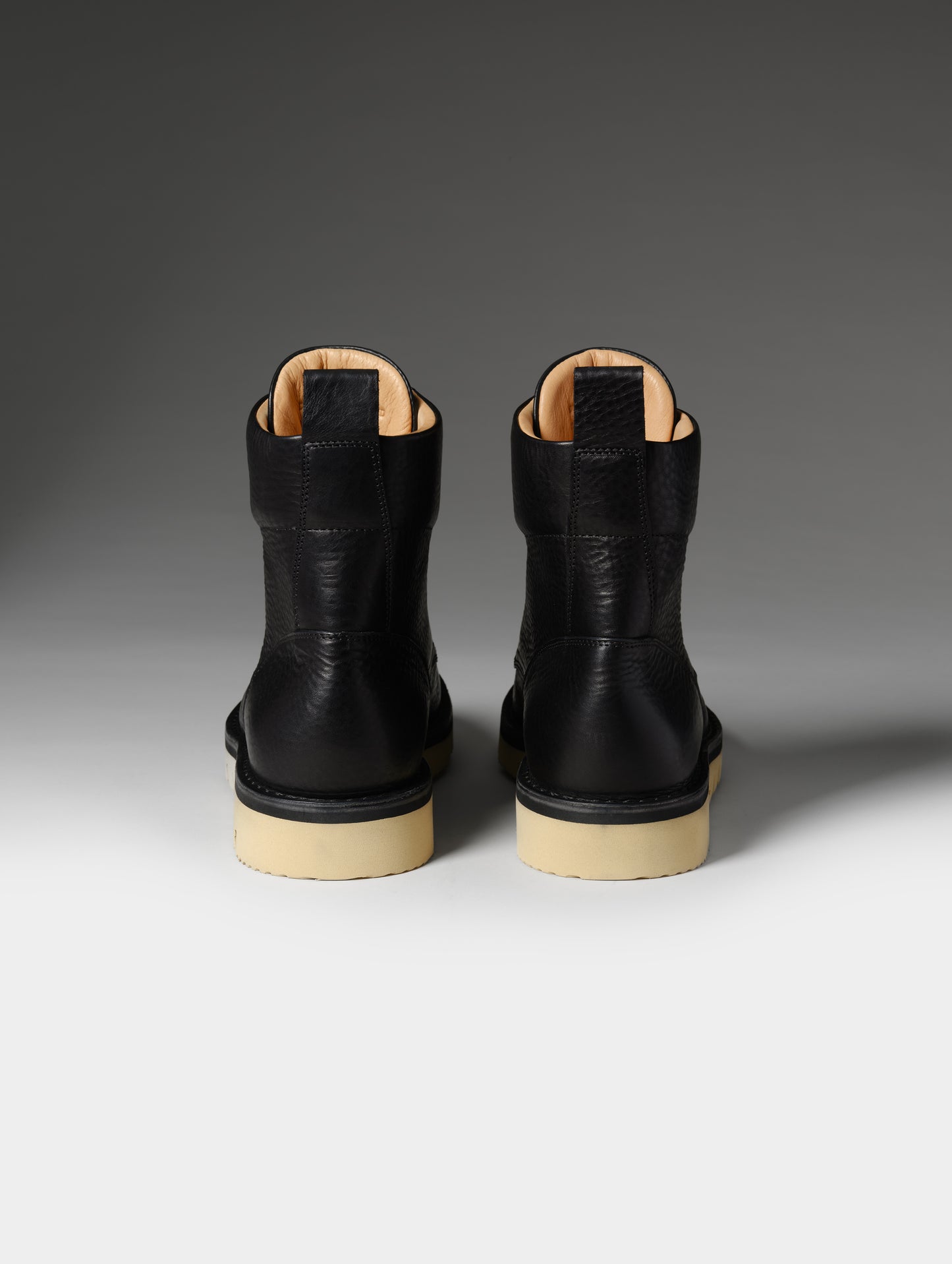 Rear studio shot of the Canyon Boot in Onyx Black from AETHER Apparel.