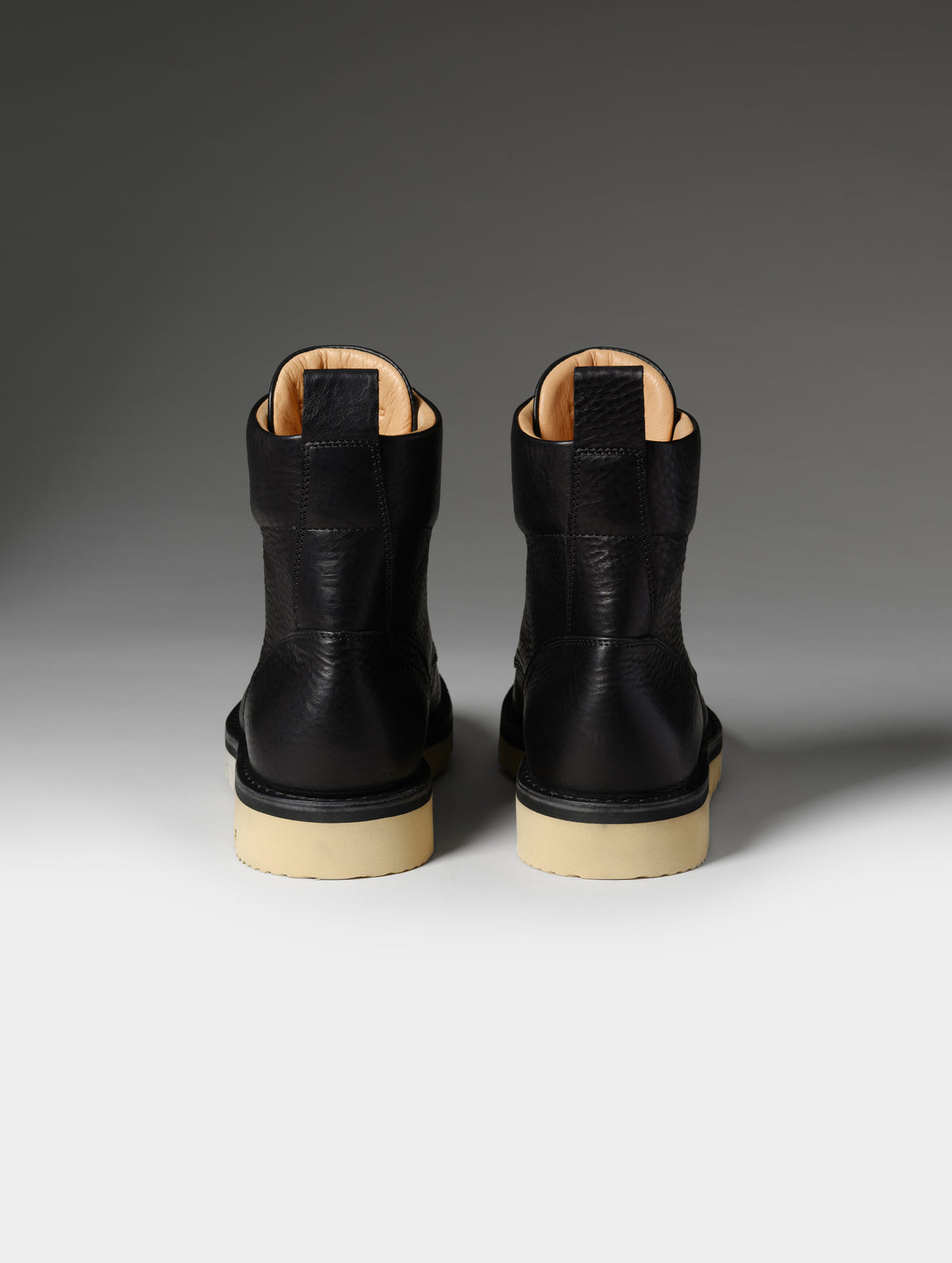 Rear studio shot of the Canyon Boot in Onyx Black from AETHER Apparel.