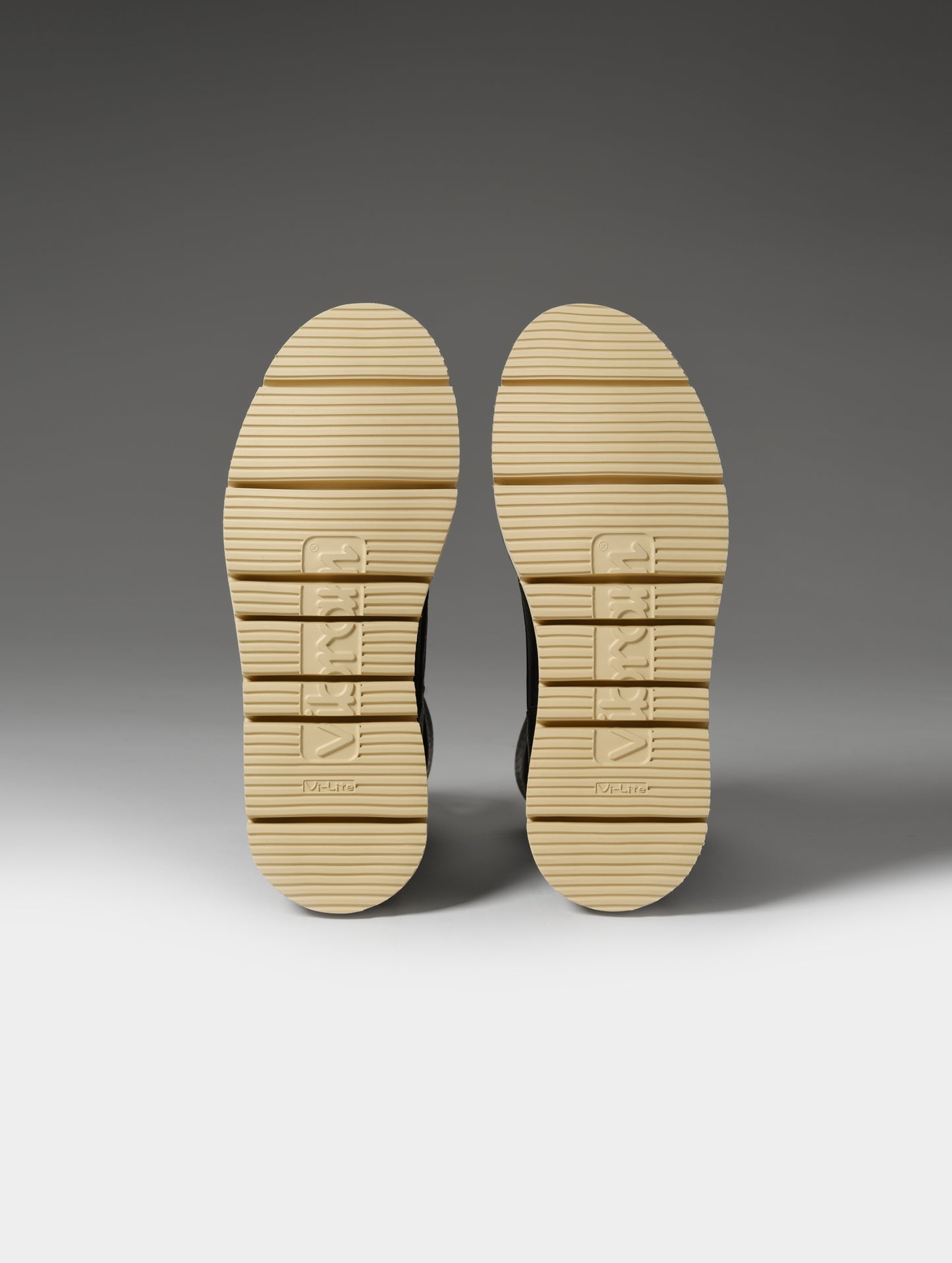 Studio shot of the Vibram outsoles on the Canyon Boot in Onyx Black from AETHER Apparel.