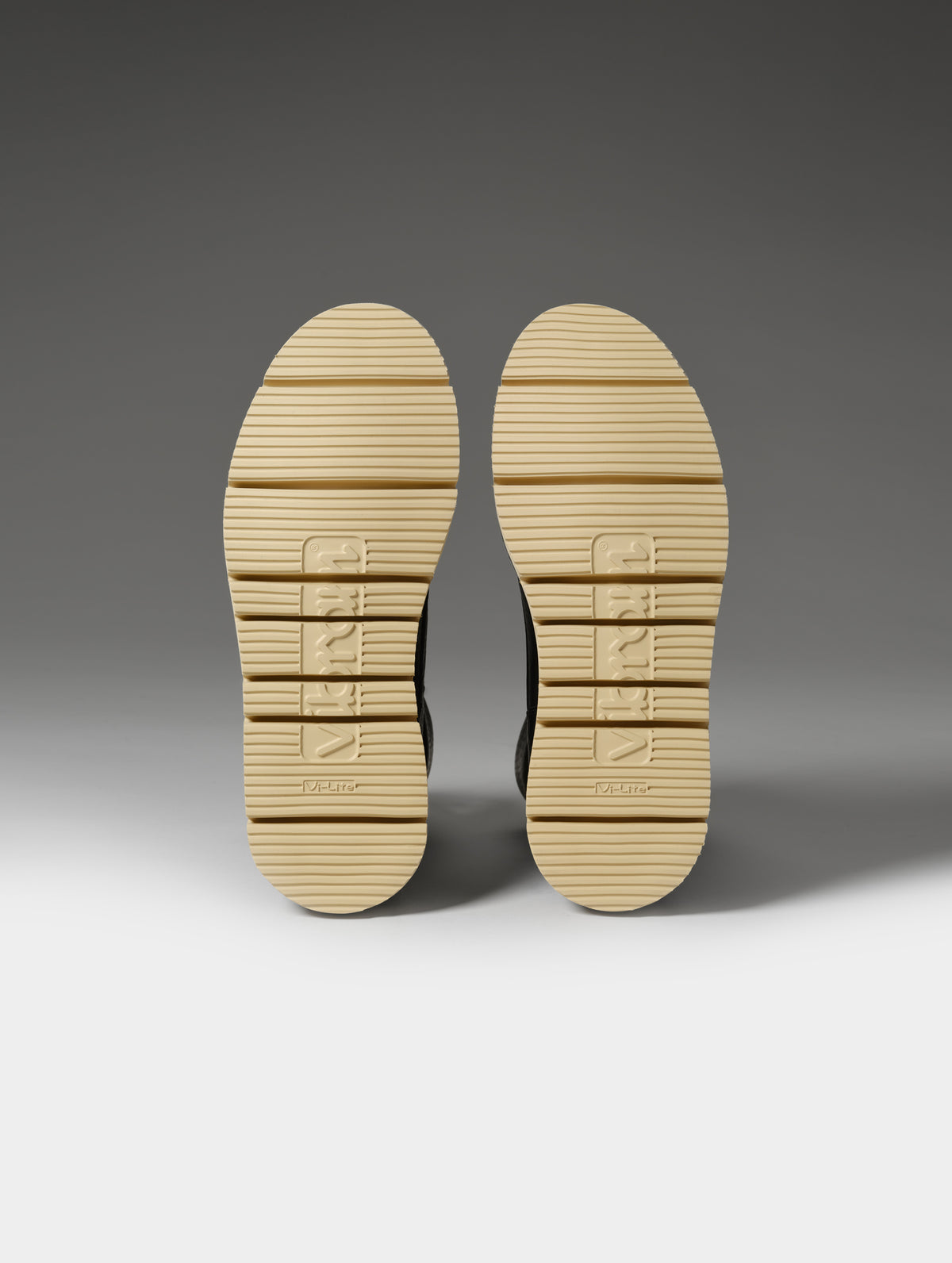 Studio shot of the Vibram outsoles on the Canyon Boot in Onyx Black from AETHER Apparel.