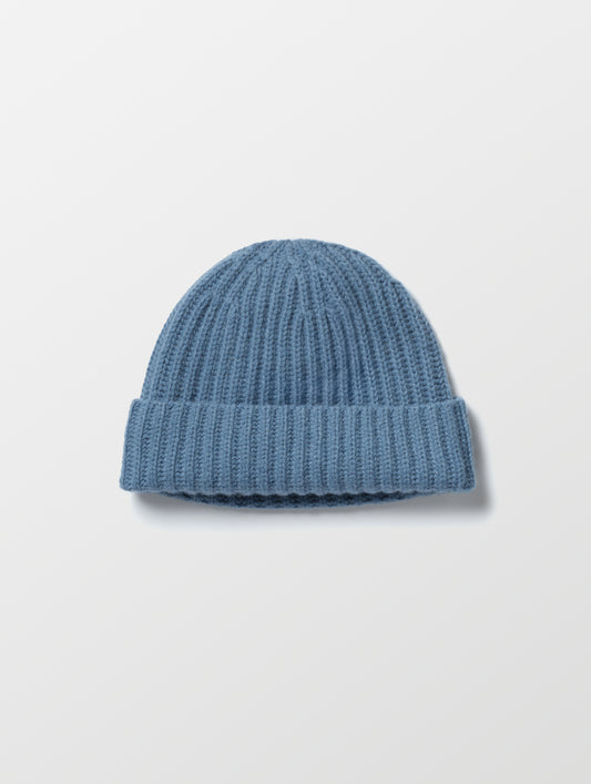 Flat lay of the Cashmere Hat in Portal Blue from AETHER Apparel. 