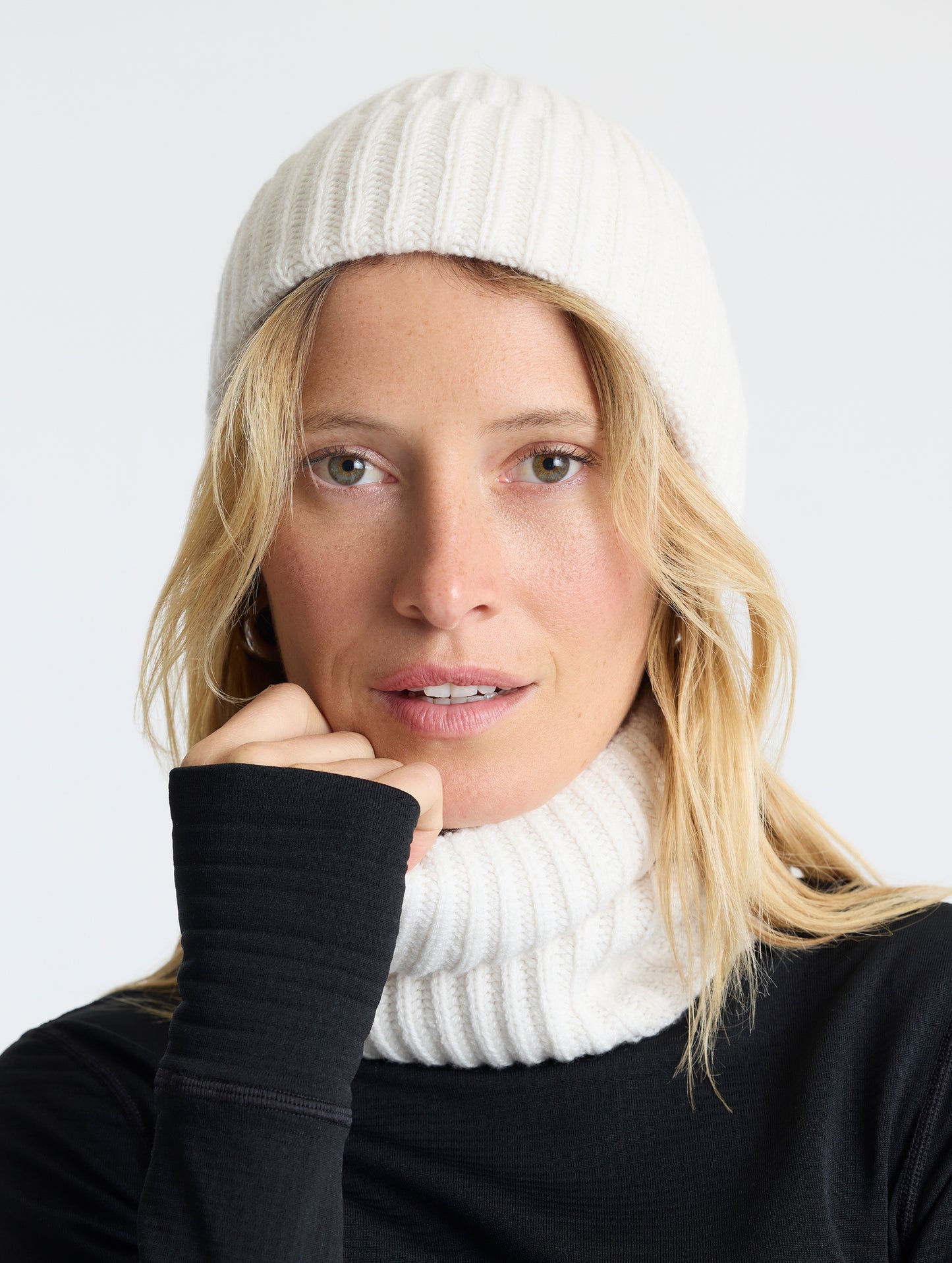 Front view of woman wearing the Cashmere Hat in Winter White from AETHER Apparel.