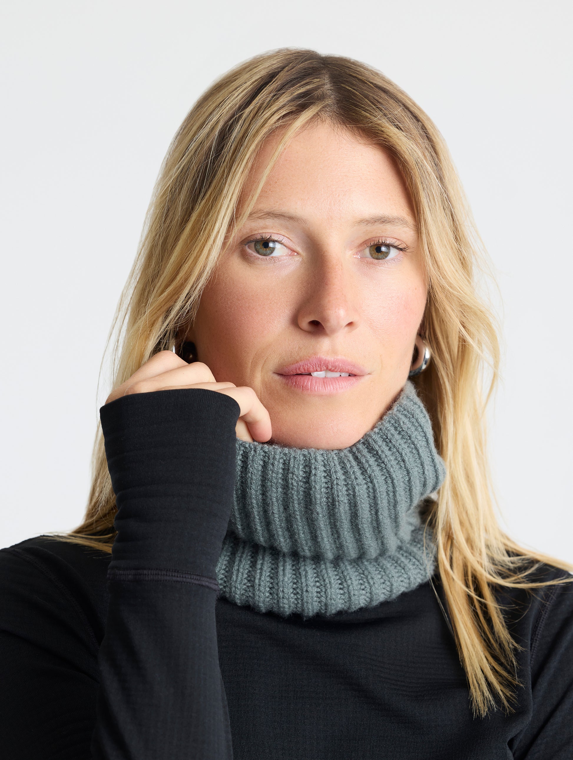 Front view of woman wearing the Cashmere Neck Gaiter in Gunmetal from AETHER Apparel. 