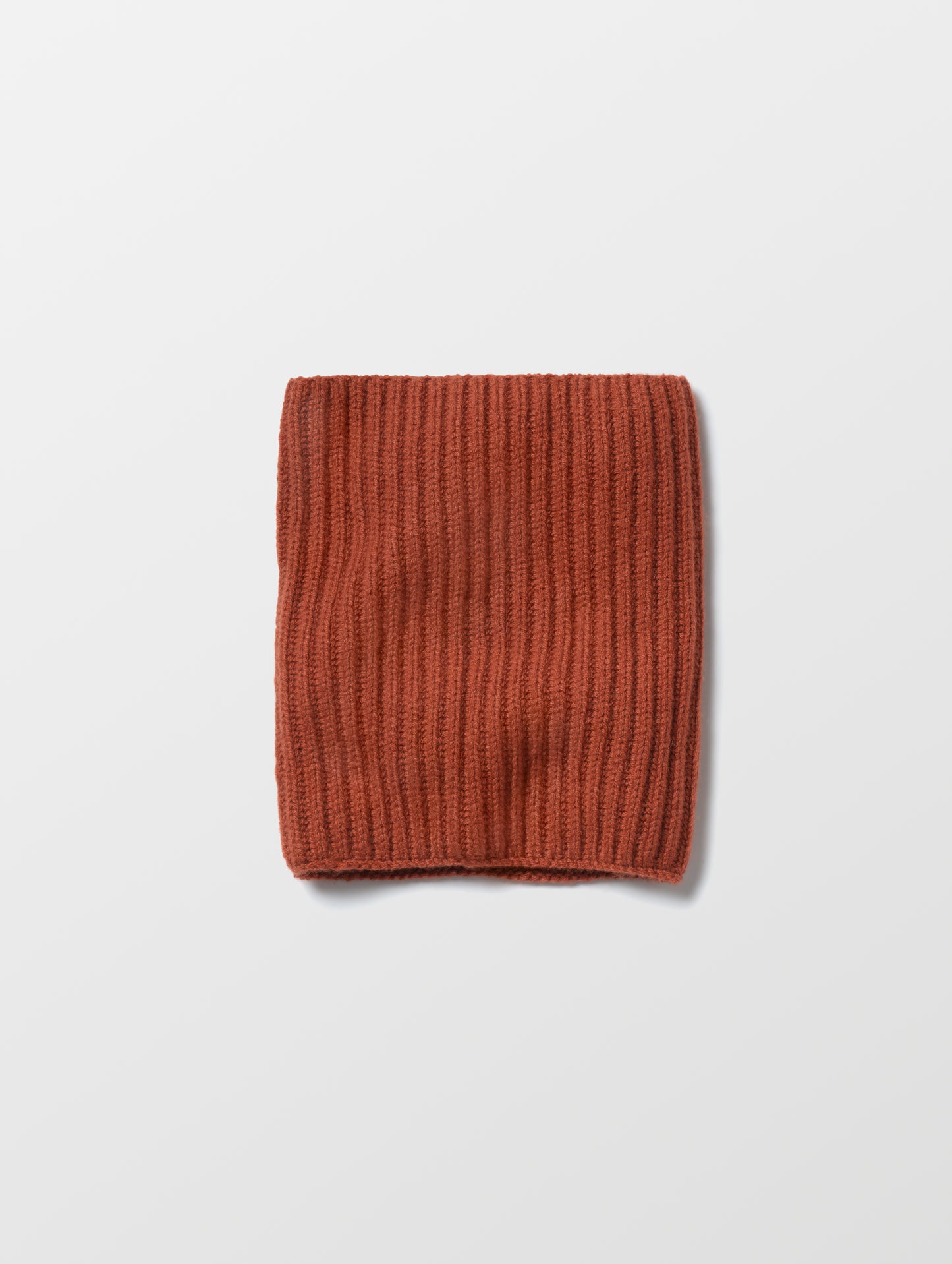 Flat lay of the Cashmere Neck Gaiter in Redwood Rust from AETHER Apparel. 