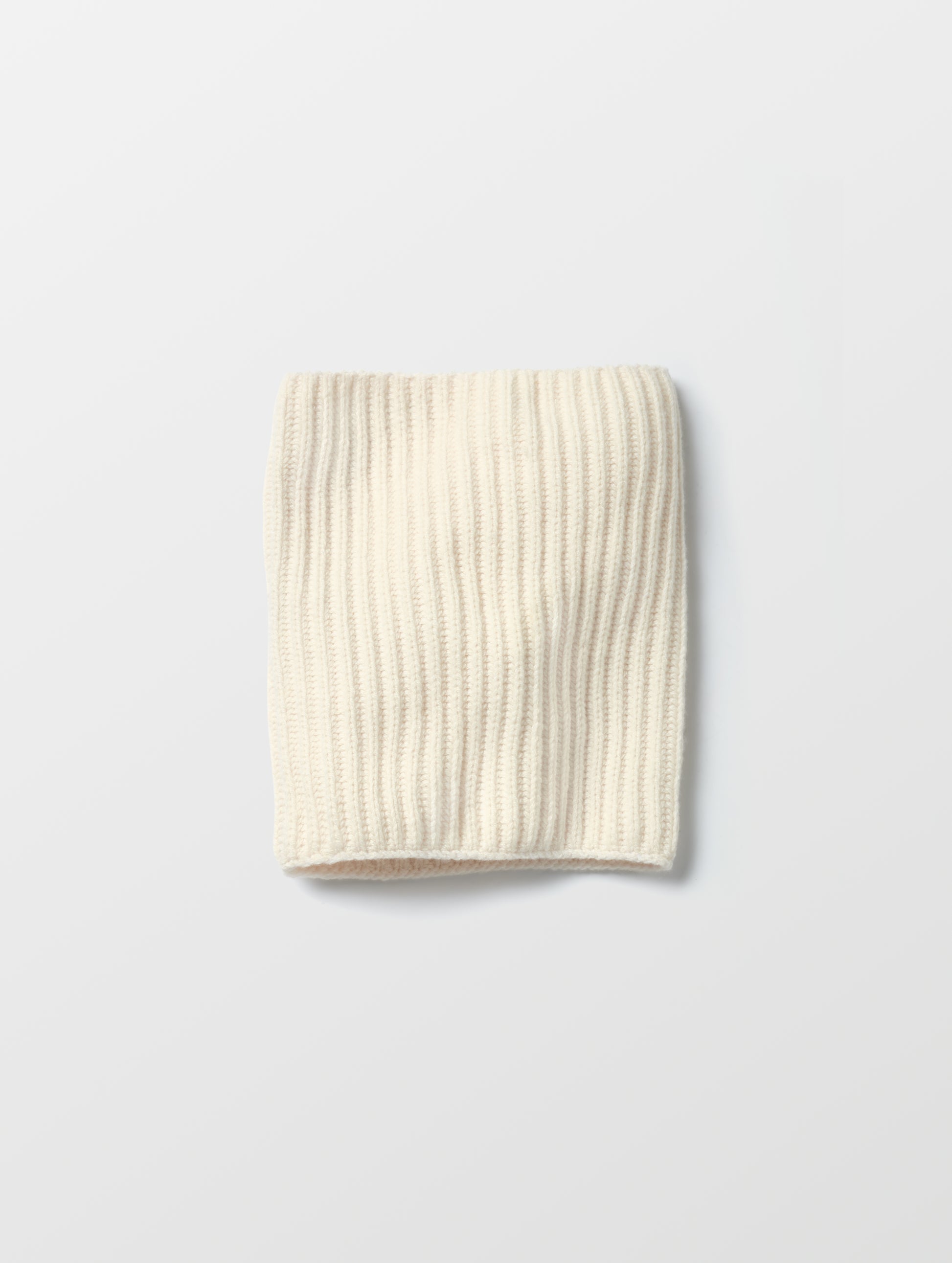 Flat lay of the Cashmere Neck Gaiter in Winter White from AETHER Apparel. 