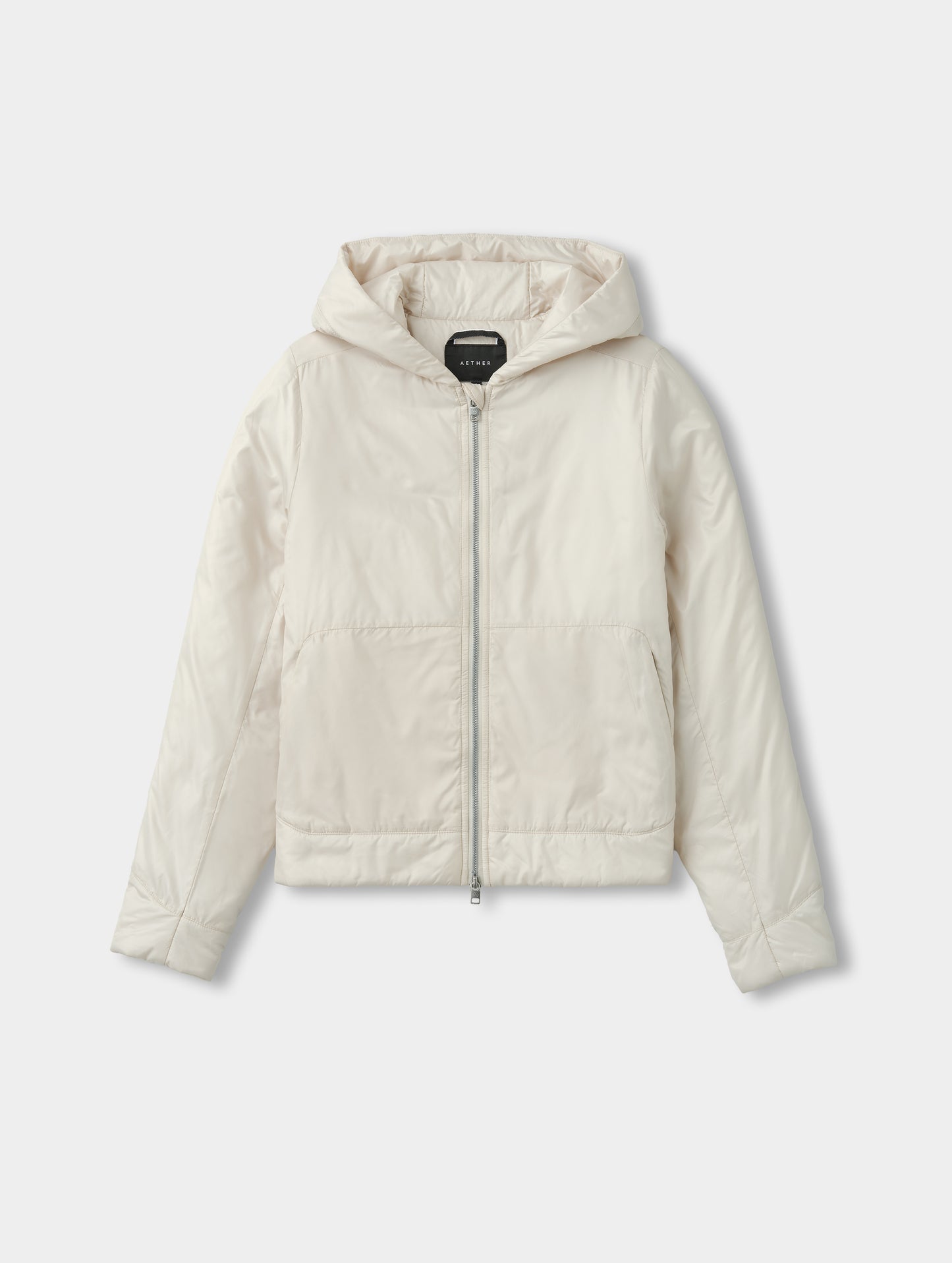 Flat lay view of the Celeste Eco Insulated Hoodie in Bone from AETHER Apparel.