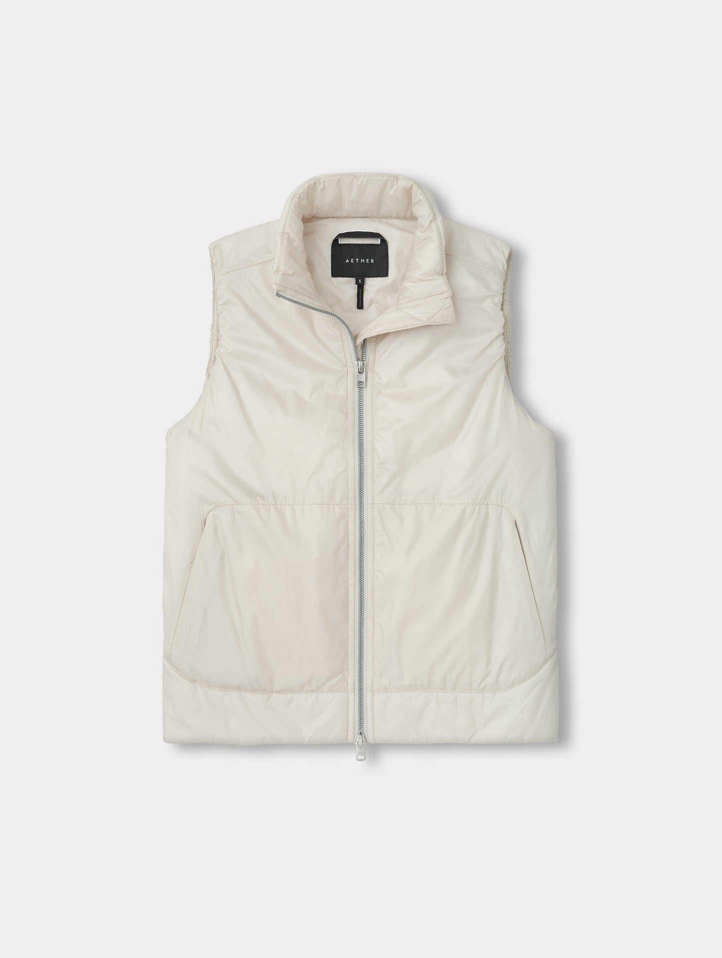 Flat lay view of the Celeste Eco Insulated Vest in Bone from AETHER Apparel.